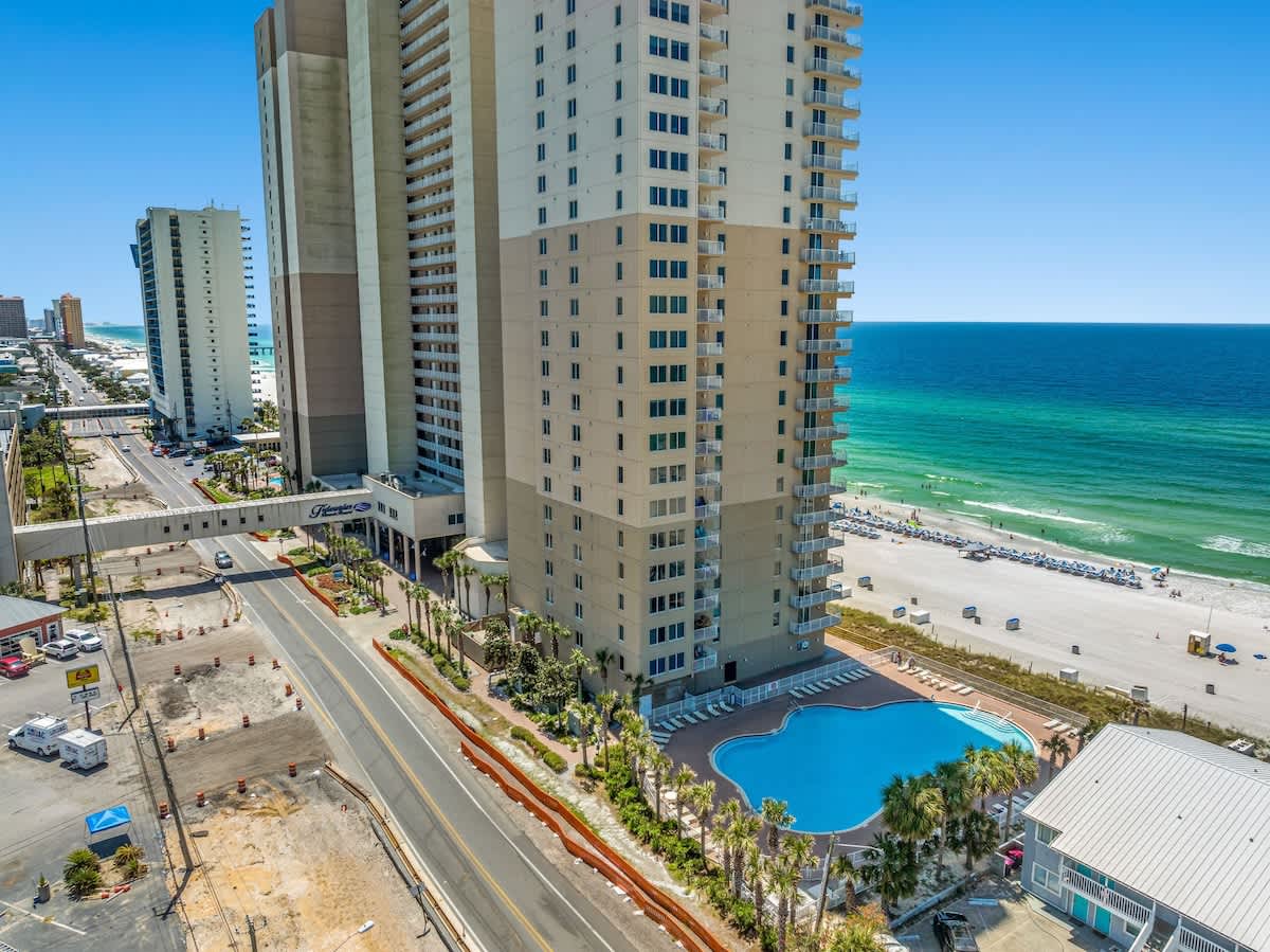Tidewater 200 – High-rise building with ocean view, nearby pool, and beach access.