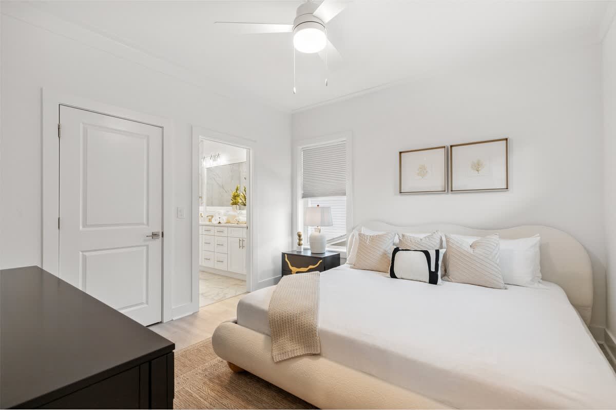 224 W Willow Mist Rd – Cozy bedroom with a bed, nightstand, and access to an en-suite bathroom.