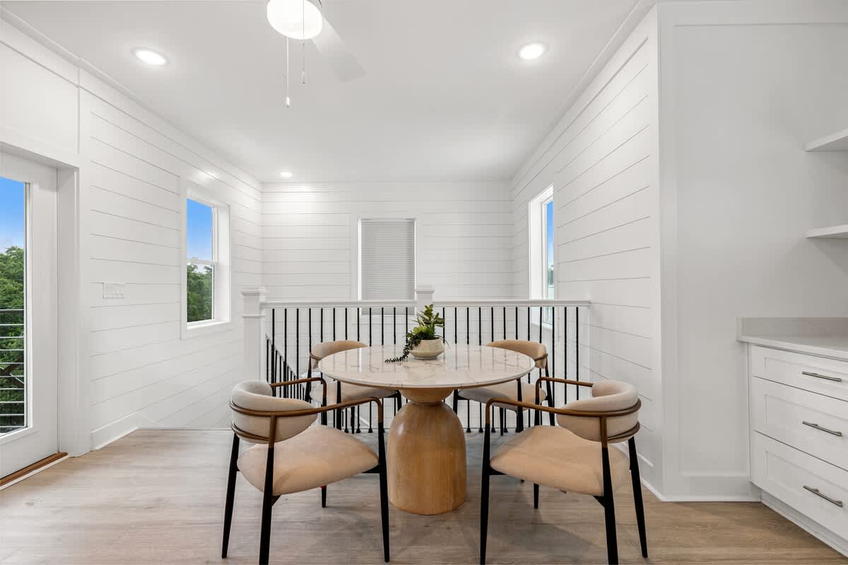 224 W Willow Mist Rd – Bright dining area with a round table, four chairs, and large windows showcasing a view.