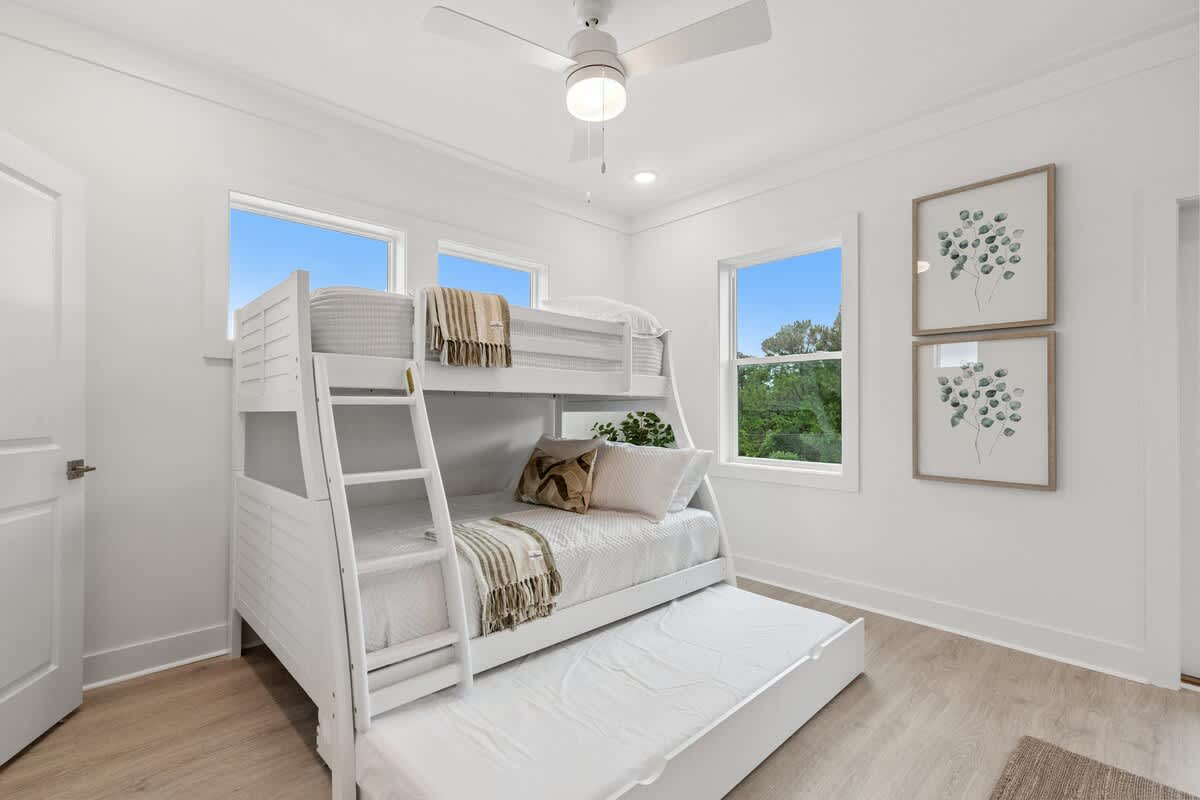 224 W Willow Mist Rd – Bright bedroom with a bunk bed, window views, and decorative wall art.