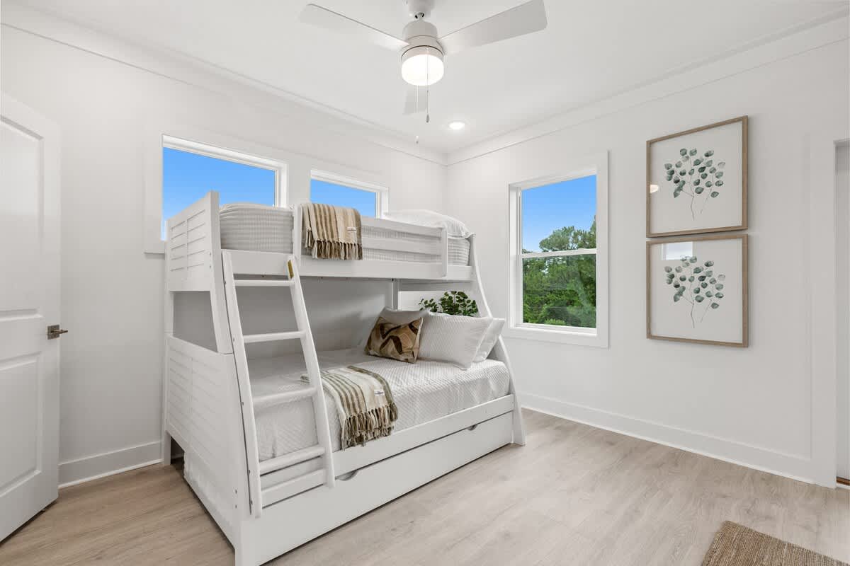 224 W Willow Mist Rd – Bright bedroom featuring bunk beds, two windows, and light wood flooring.