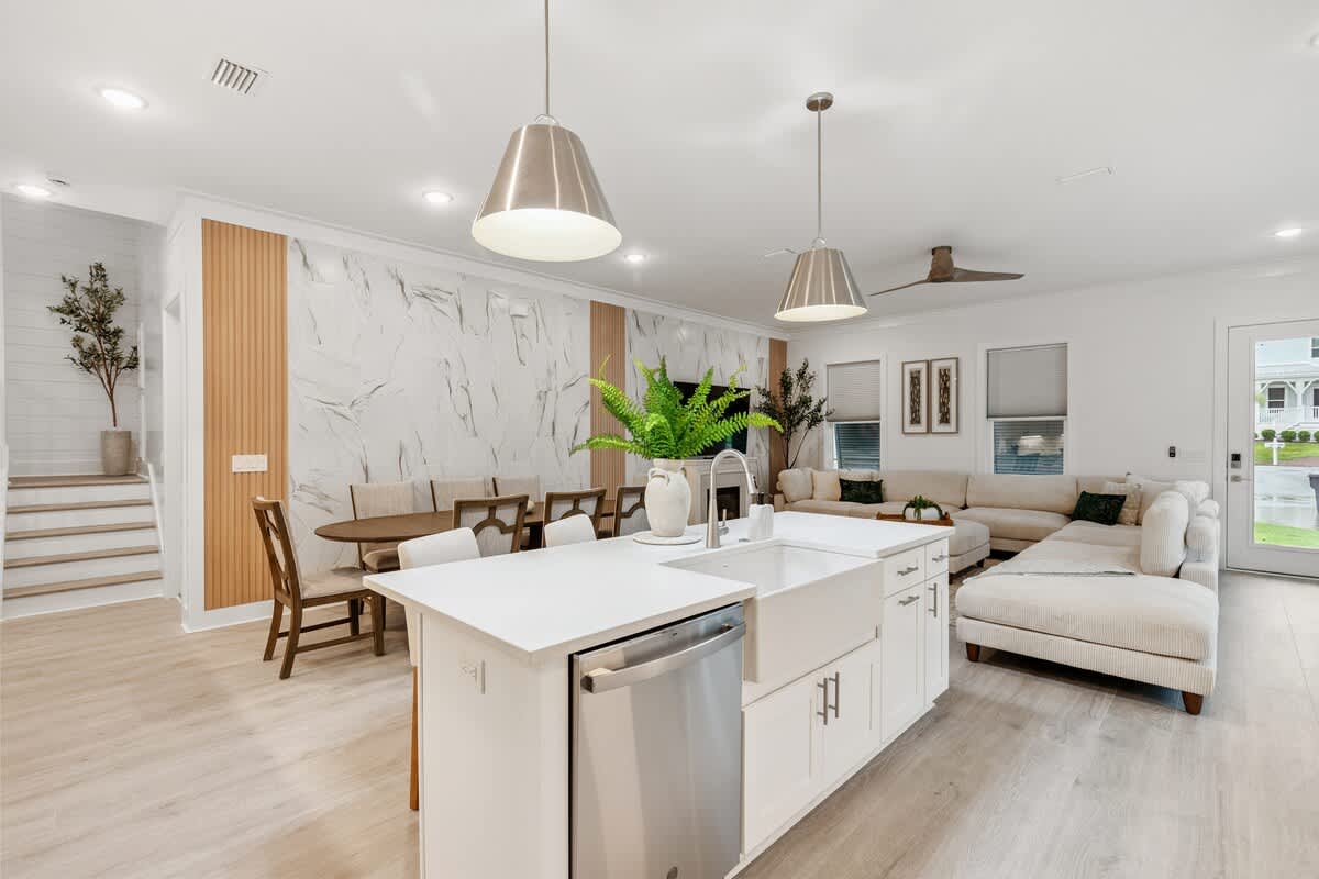 224 W Willow Mist Rd – Open living area with kitchen, dining table, comfortable seating, and large windows.