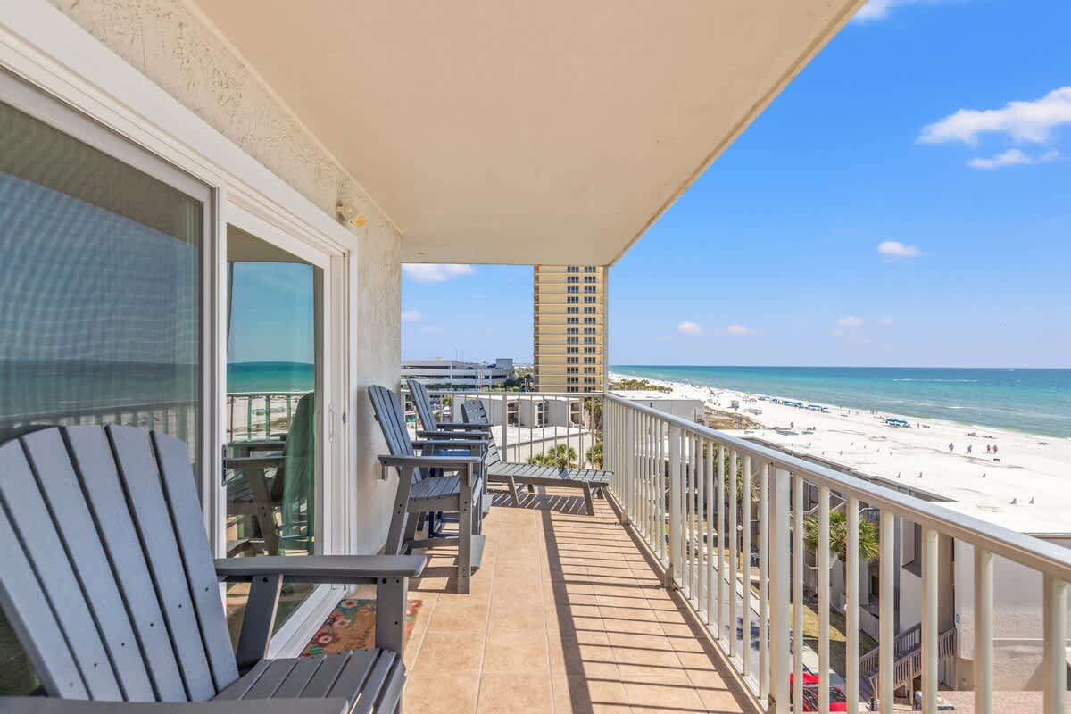 The Summit 632 – Balcony with four chairs overlooking beach and ocean view.