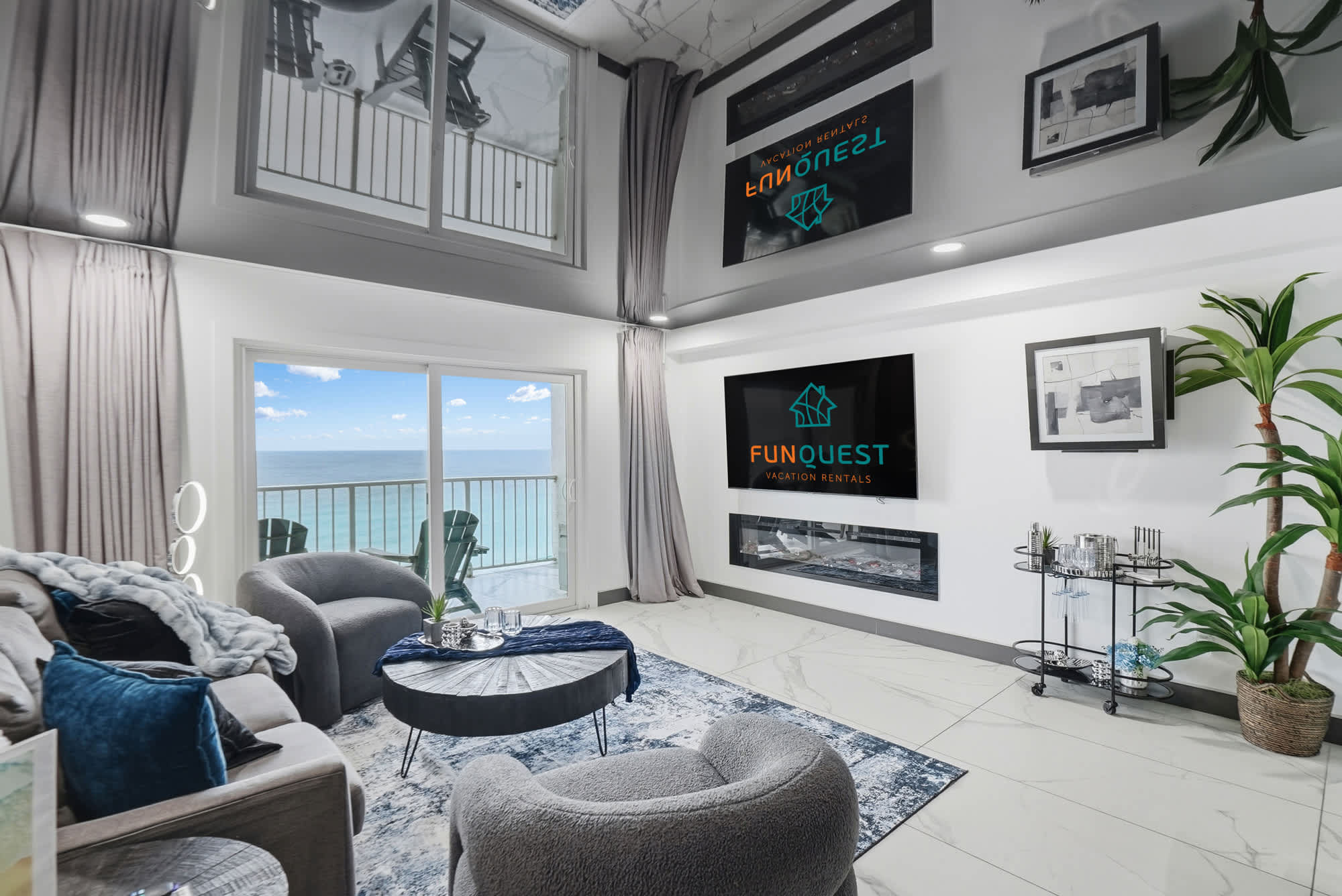 The Summit 1208 – Spacious living room with ocean view, plush seating, modern decor, and flat-screen TV.