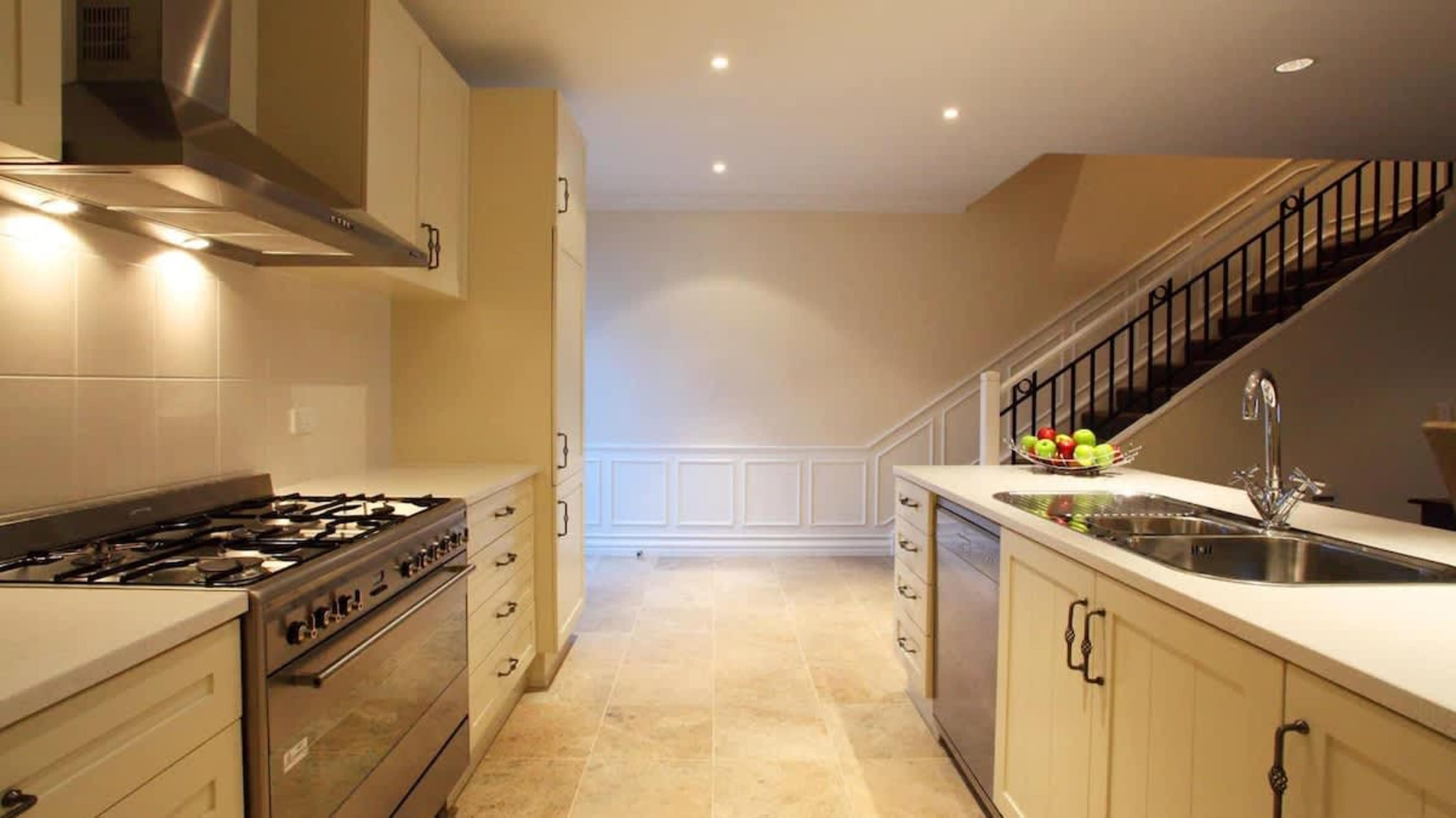 Functional and Stylish Kitchen
Enjoy the convenience of a contemporary kitchen, complete with modern appliances and ample space, perfect for cooking and entertaining in your lakeside townhouse.