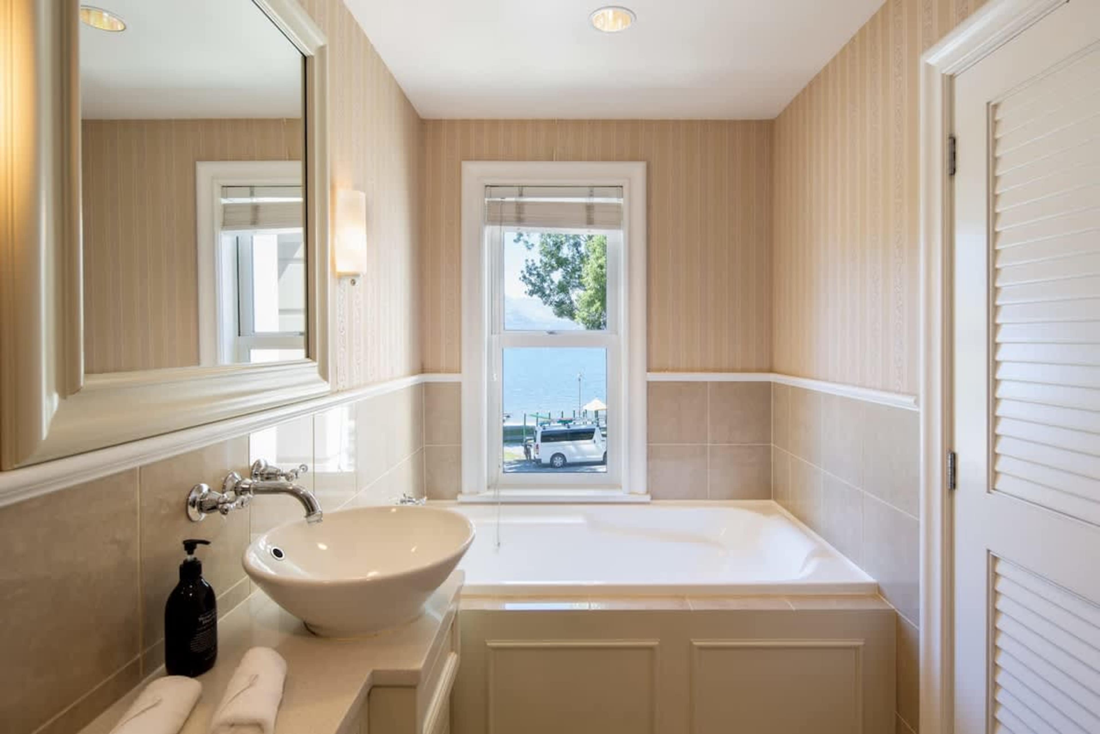 Elegant Master with Ensuite
Relax in the sophisticated master bedroom, complete with a private ensuite featuring luxurious Ashley & Co toiletries, ensuring a serene and pampered stay.