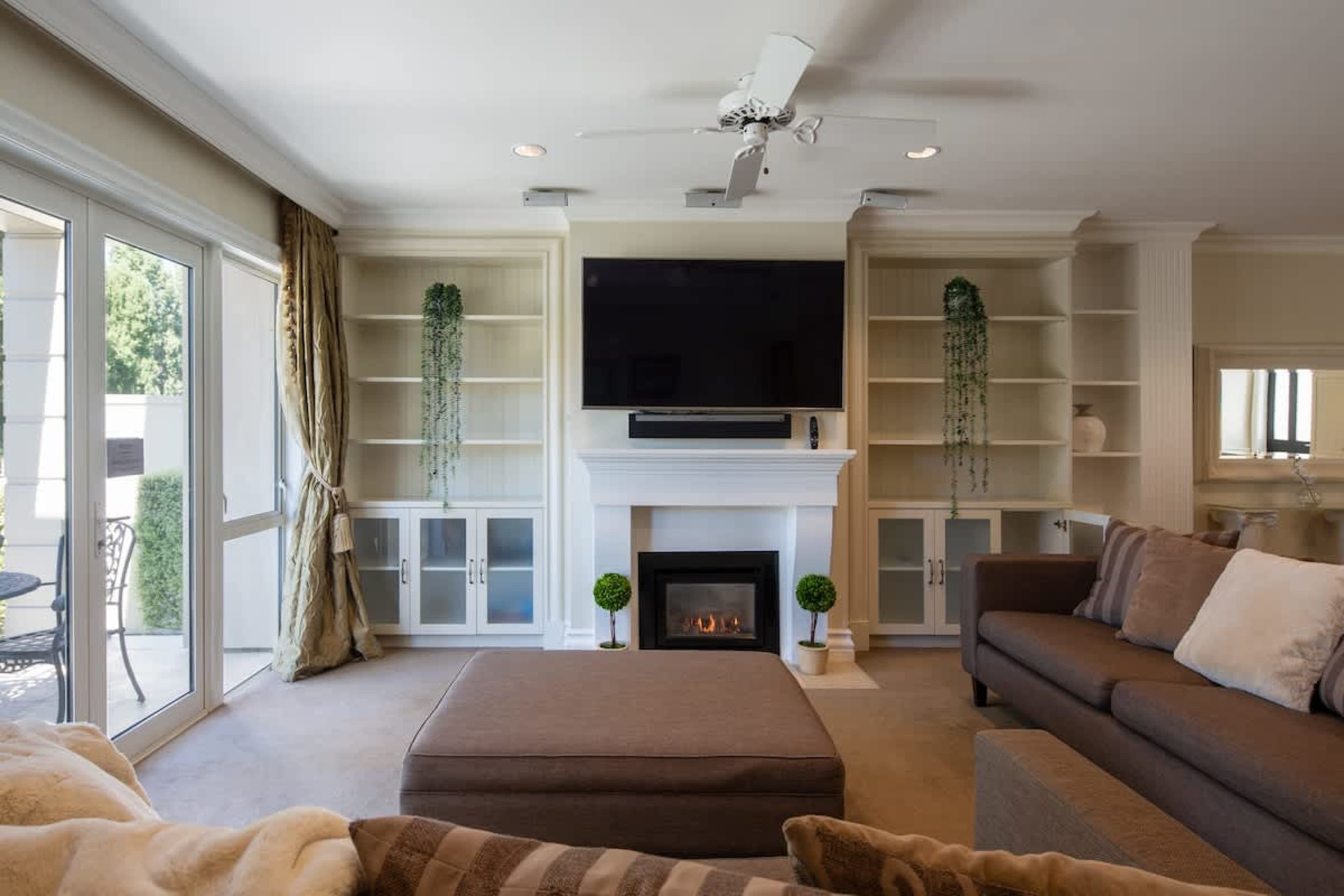 Stylish Comfort
Unwind in the modern living area, featuring a gas fireplace and elegant furnishings, perfect for cozy evenings across from the stunning lake.