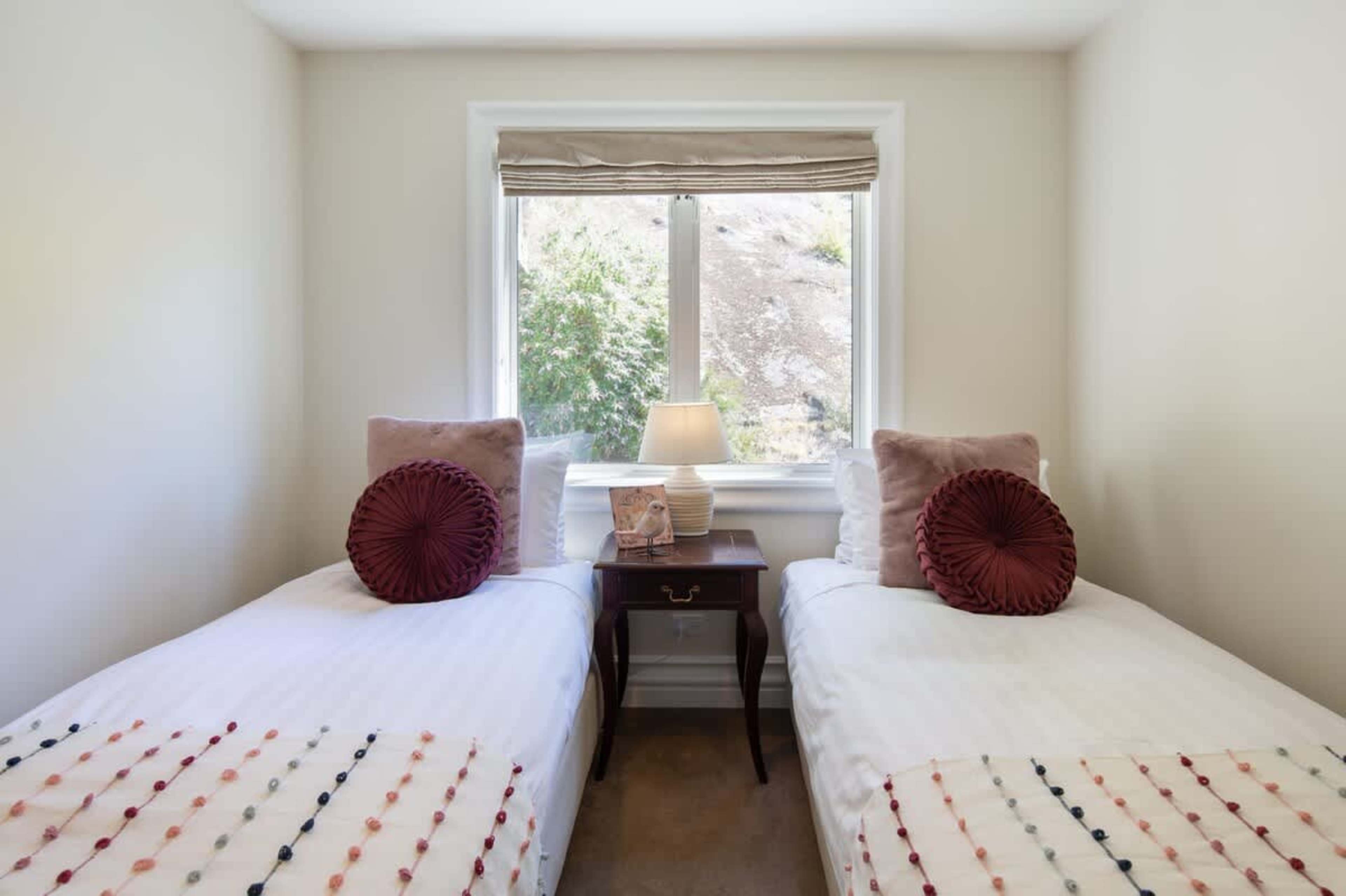 Versatile Third Bedroom
The third bedroom features a king-split bed, offering flexible sleeping options for couples or friends, with cozy furnishings and a relaxing ambiance. Can be a king bed or split into single beds.