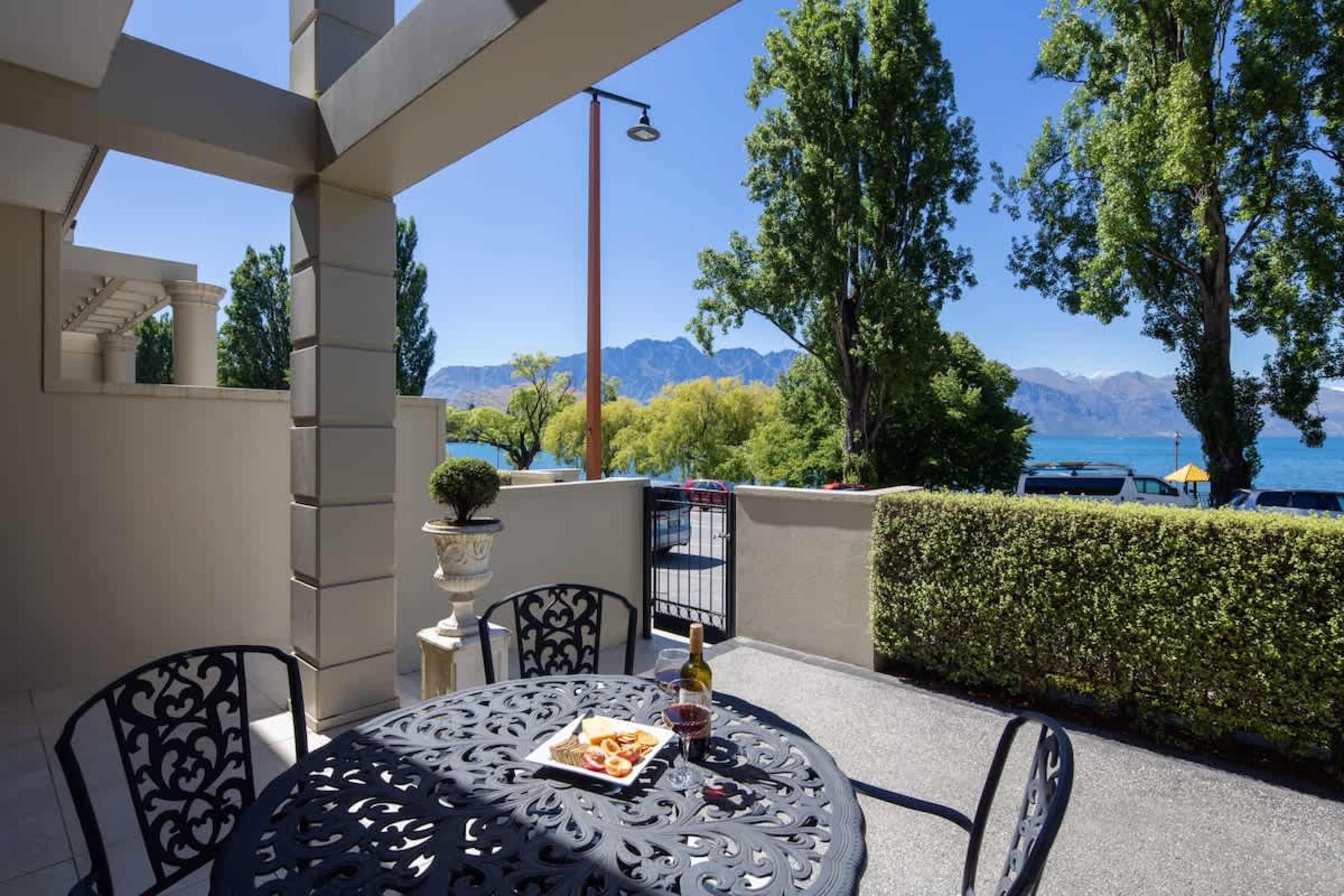 Scenic Patio with Lake Views
Relax on the patio while taking in stunning lake views and watching the kids enjoy the park just across the street, all within a short stroll to Queenstown’s vibrant town center.