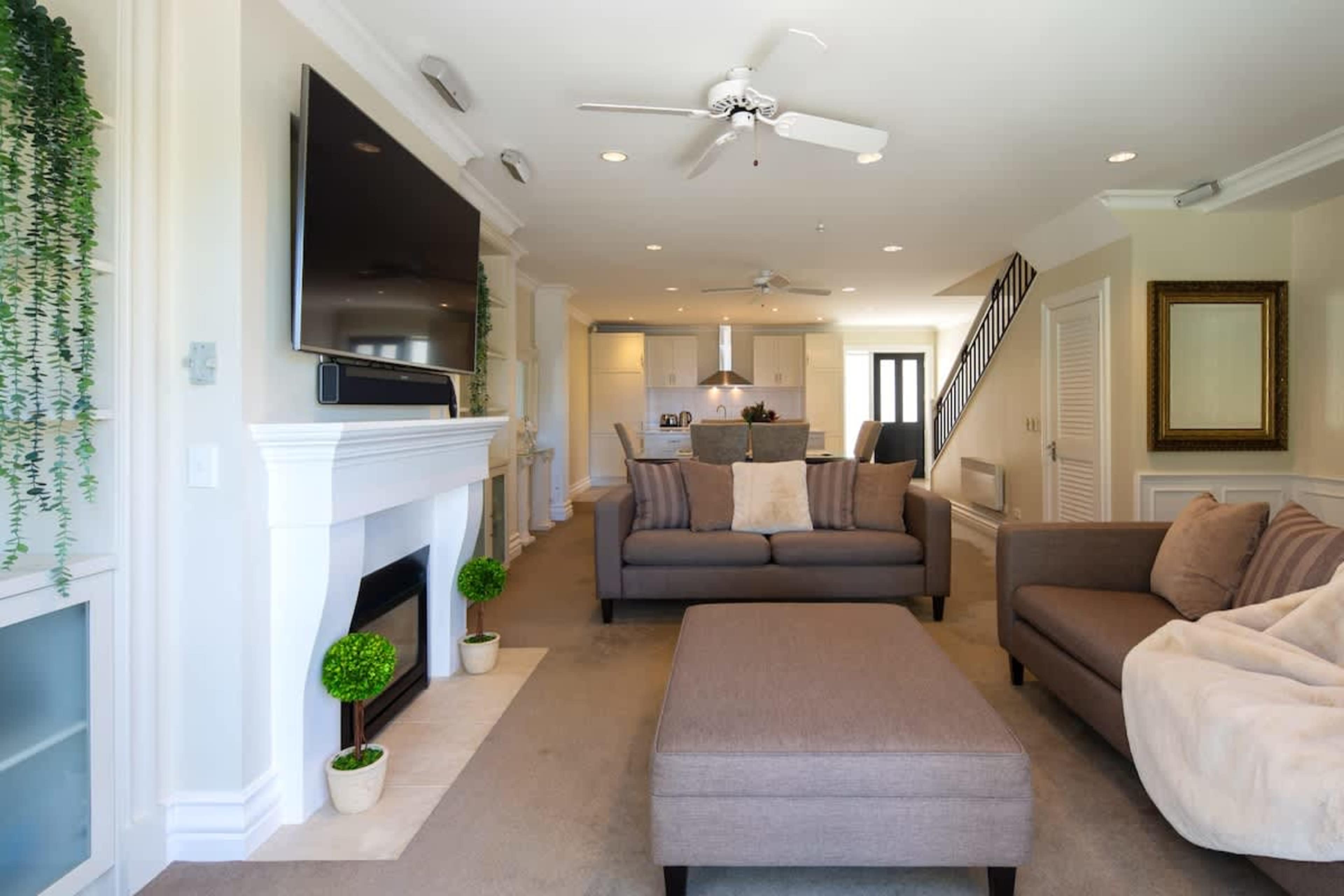 Warm and Inviting Space
Enjoy the comforts of the living room, complete with a gas fireplace and a serene atmosphere, ideal for relaxing in this lakeside townhouse.