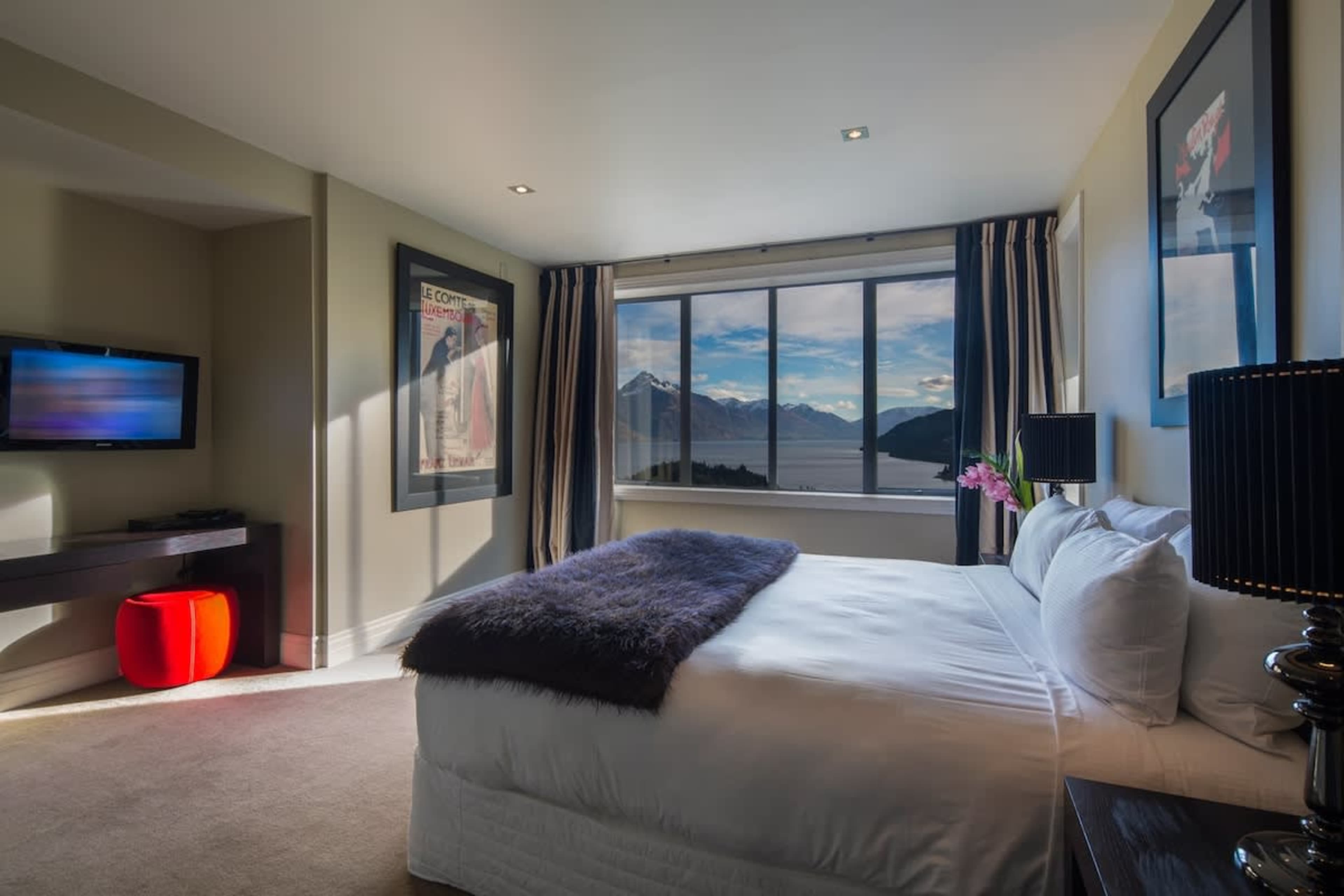 Sophisticated Comfort: Relax in this beautifully styled master suite with luxe bedding, a plush new mattress, and a private ensuite for a peaceful escape.