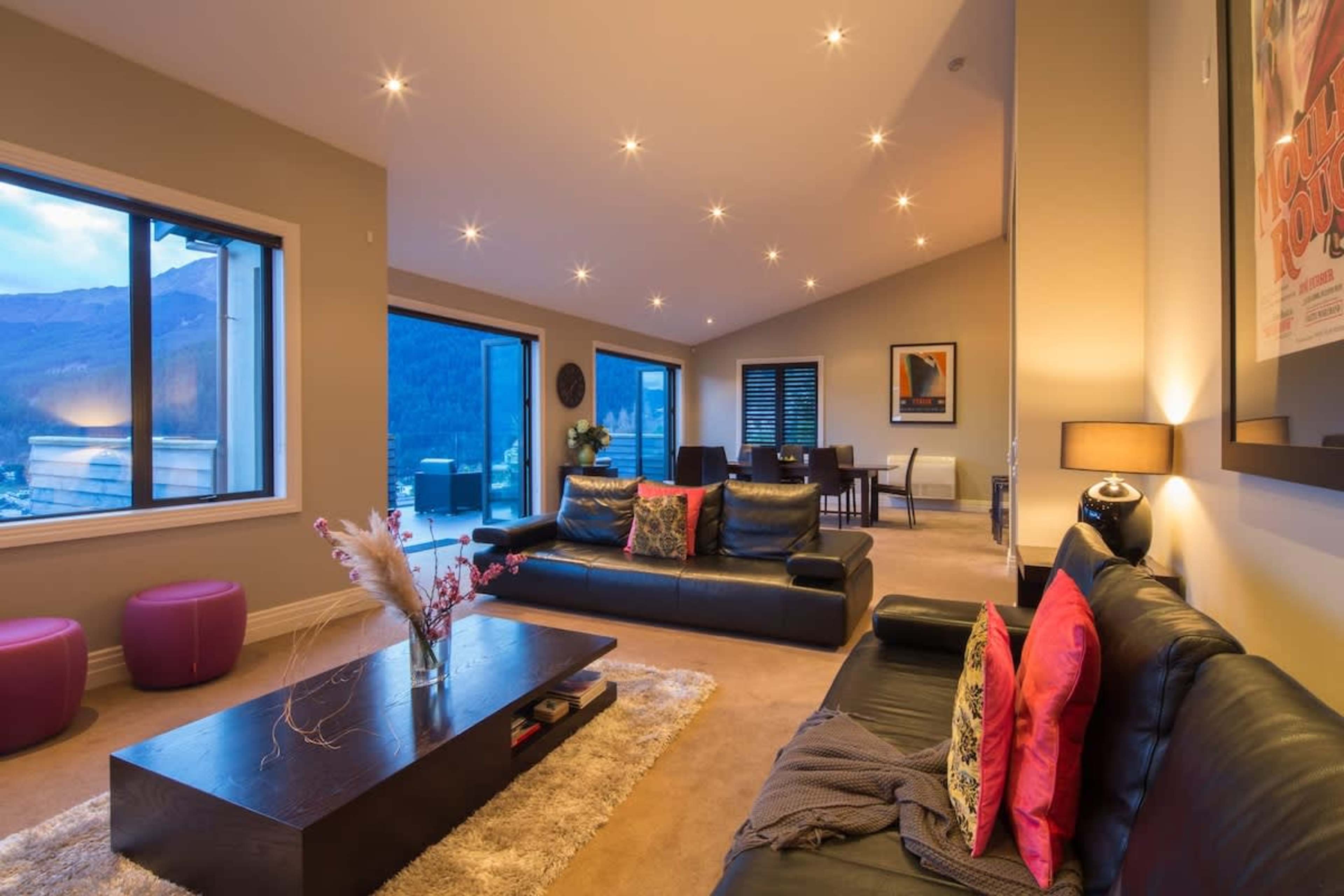 Sophisticated Comfort: A spacious living area with contemporary design, perfect for enjoying quality time with loved ones or curling up with a book by the fire.