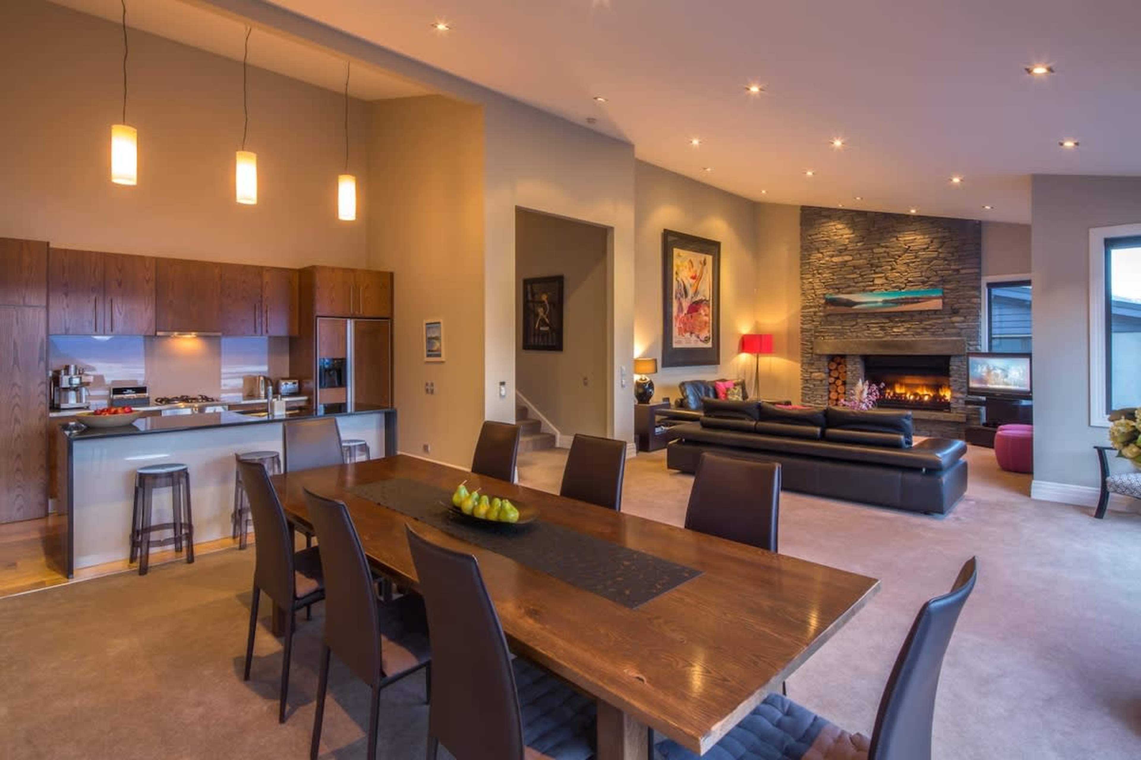 Dine with a View: The elegant dining area seamlessly connects to the spacious deck, offering stunning lake and mountain views for an unforgettable mealtime experience.

Luxury escape - New Zealand