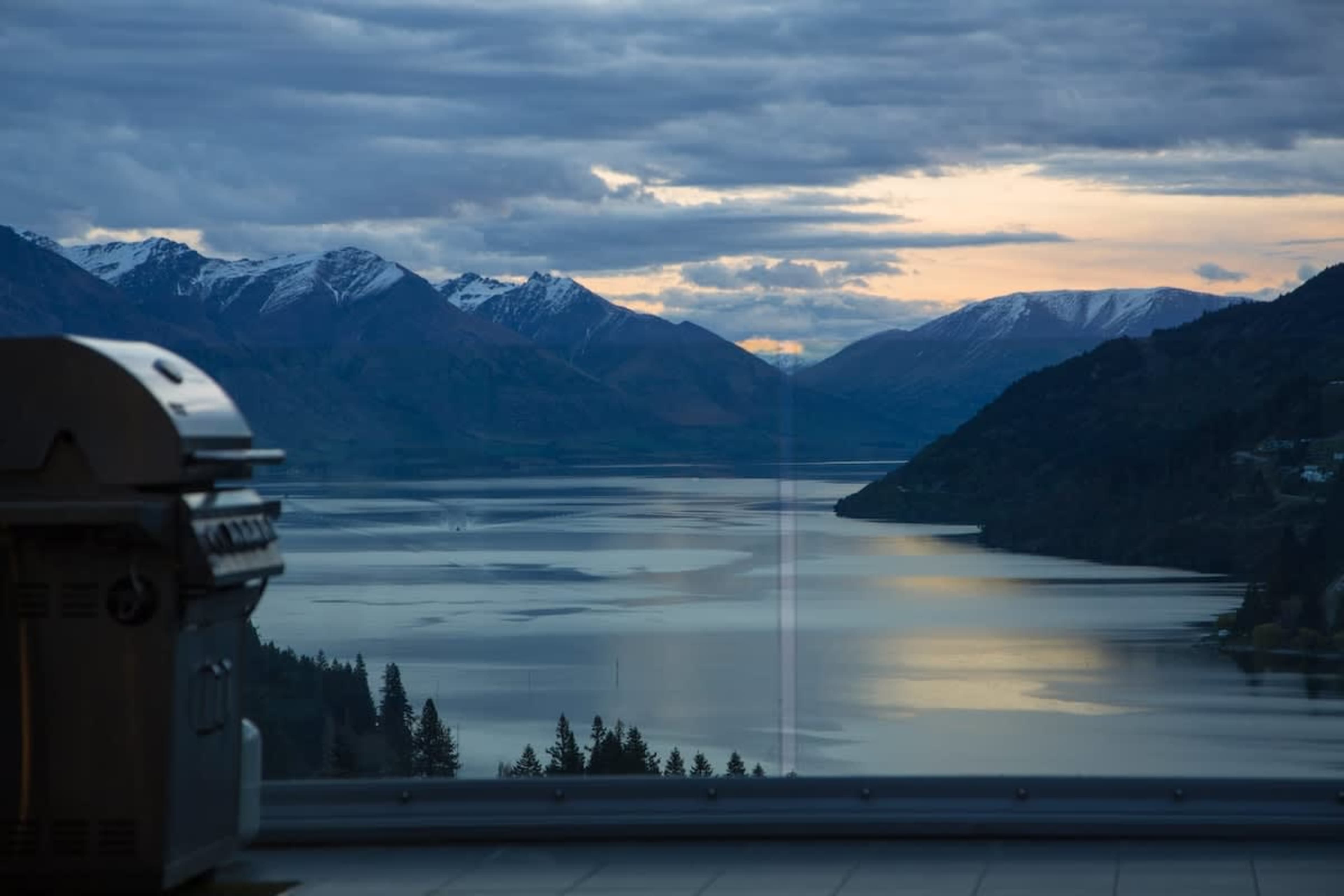 Alfresco Dining with a View: Enjoy a BBQ on the balcony while taking in the stunning lake and mountain vistas, perfect for a sunset meal.