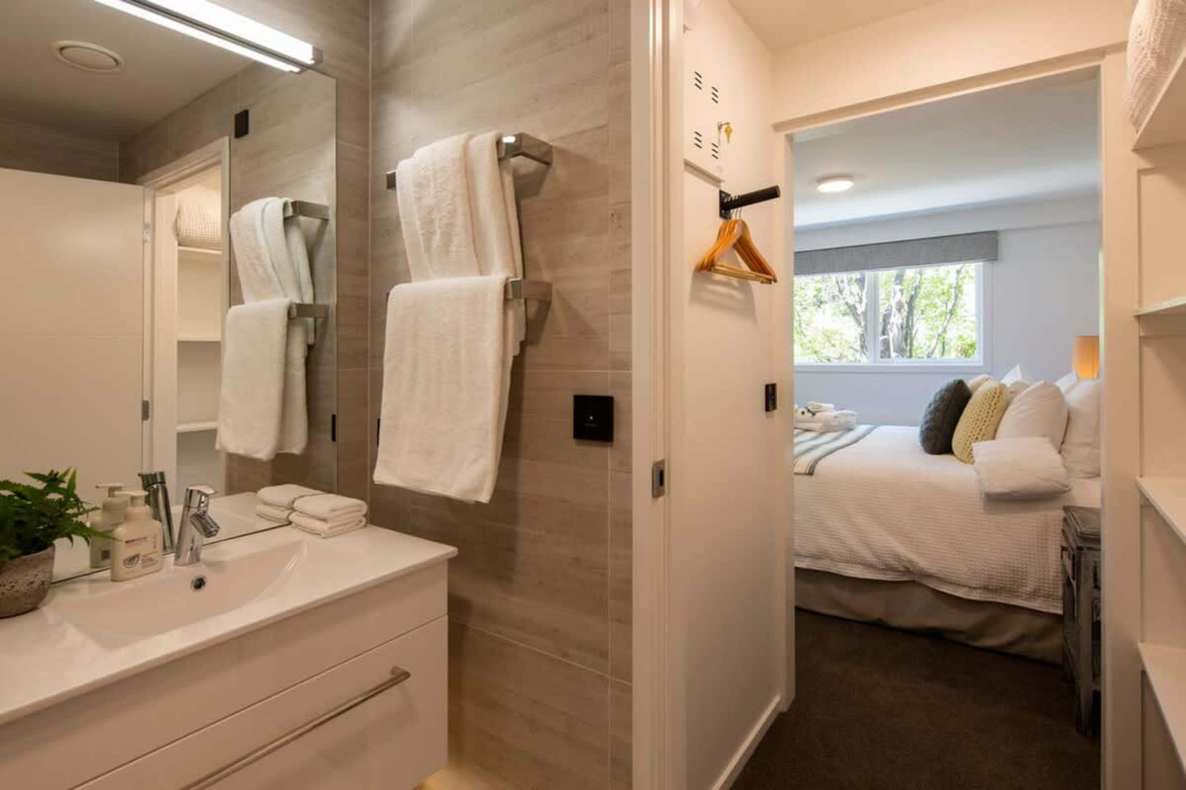 "Ensuite with Ashley Amenities, and Wardrobe Access"
This modern ensuite includes a walk-in shower, luxurious Ashley & Co. toiletries, and easy access to the wardrobe. With contemporary finishes, it provides a comfortable and private space to unwind.