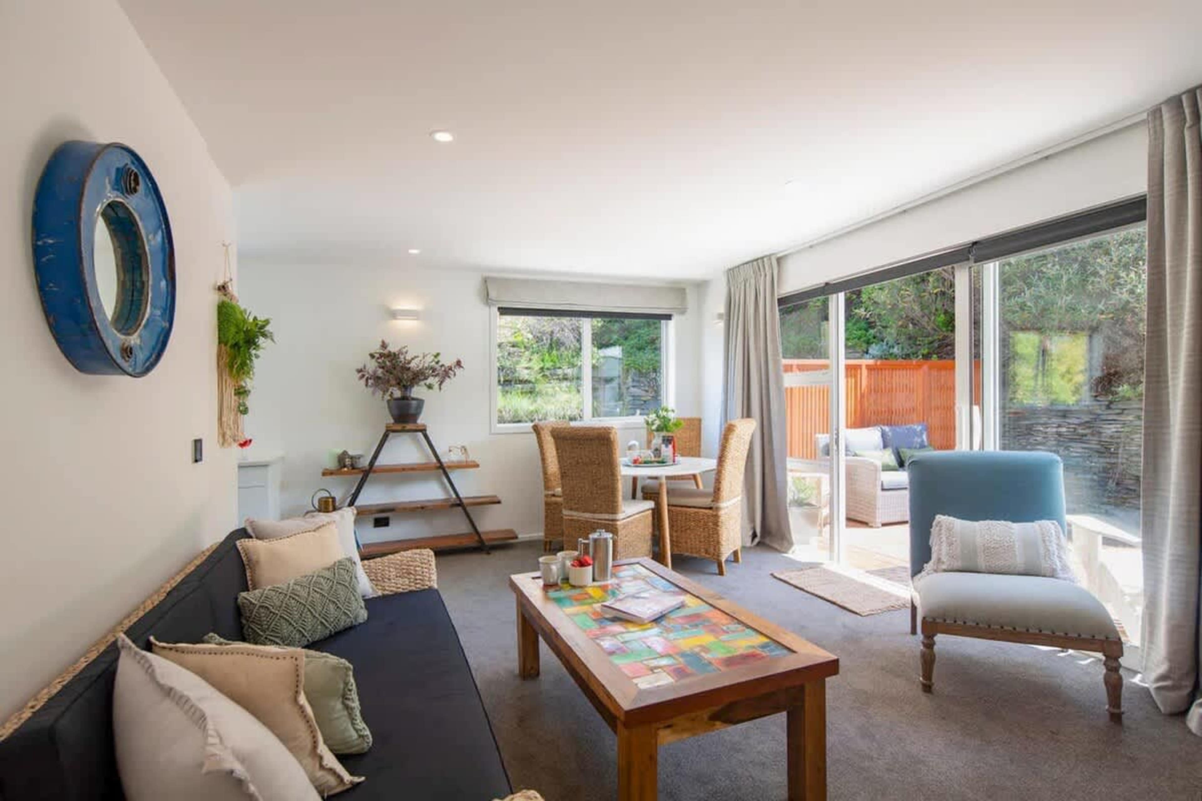 Bright Living Room with AV System and Patio Access
This inviting living room comes with a smart TV, Netflix, and Sonos Playbar. Step through the patio doors to enjoy the outdoors, offering a perfect blend of indoor relaxation and outdoor enjoyment.