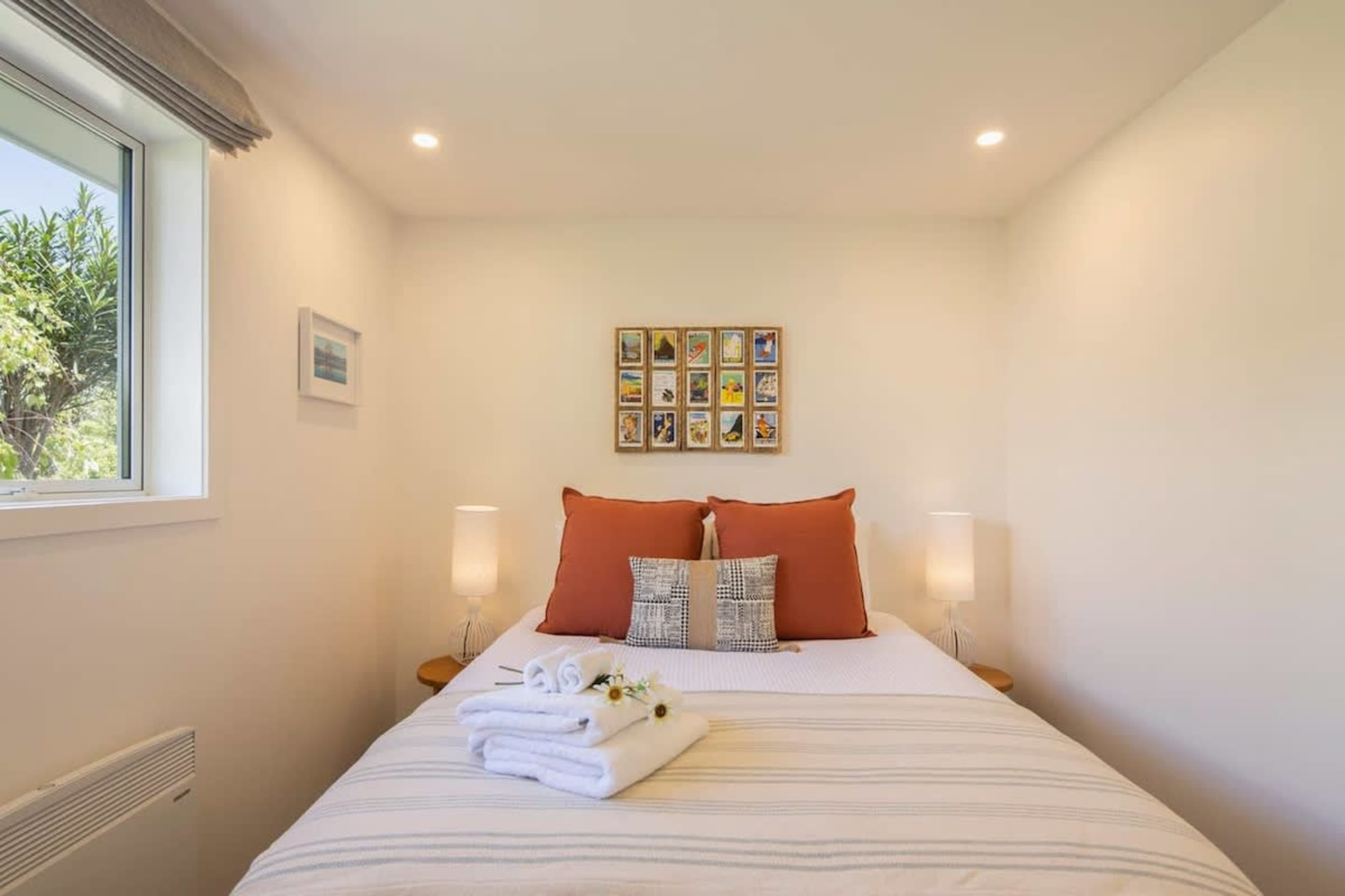 Second Bedroom with Ensuite, and Wardrobe
This comfortable second bedroom features a queen bed, a private ensuite, and a wardrobe for your convenience. A perfect space for relaxation, it offers privacy and all the essentials for a restful stay.