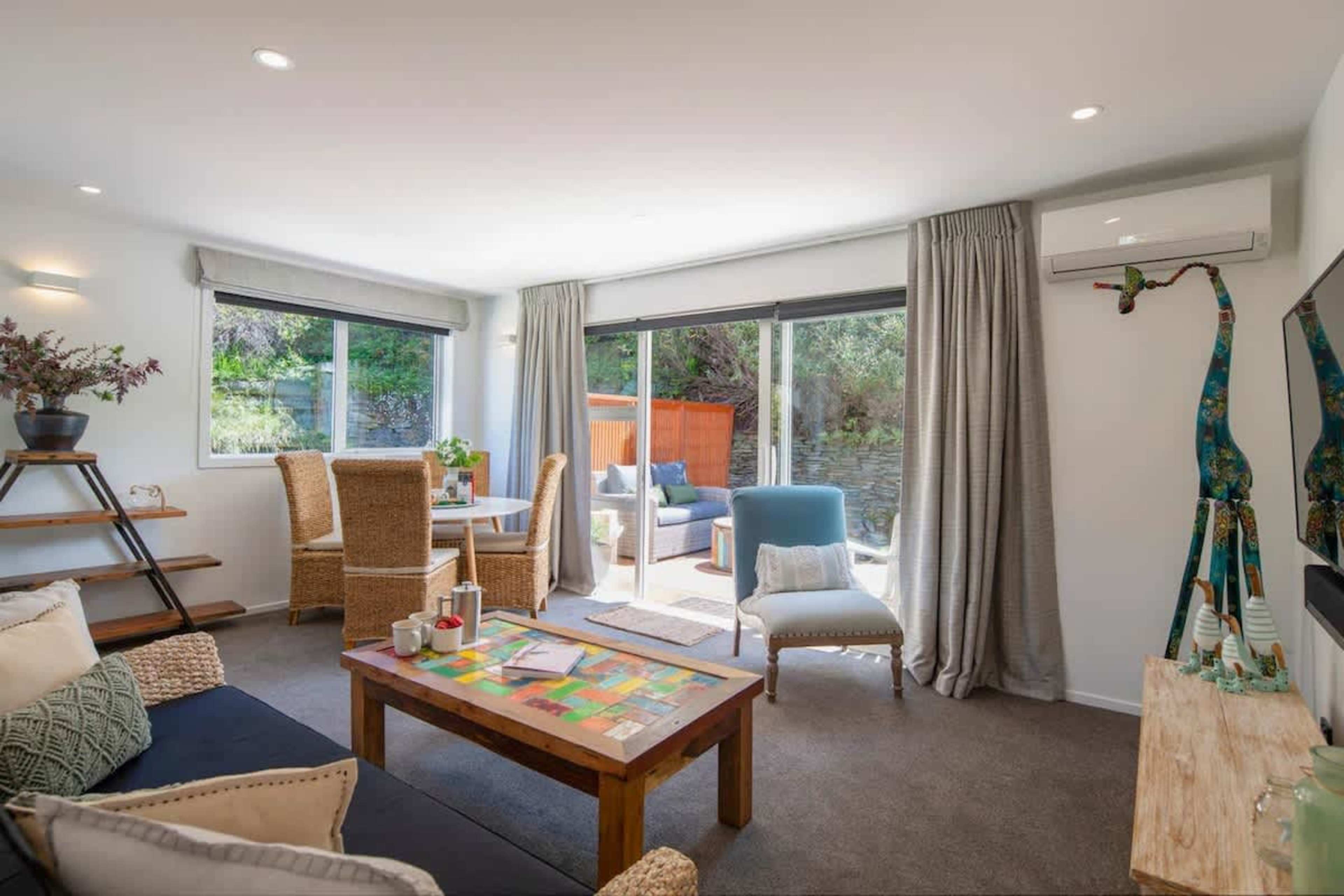 Living Room with Smart AV and Patio Access
Relax in the spacious living room featuring a smart TV, Netflix, and Sonos Playbar. With direct access to the sunny patio, enjoy seamless indoor-outdoor living in a comfortable, stylish space.