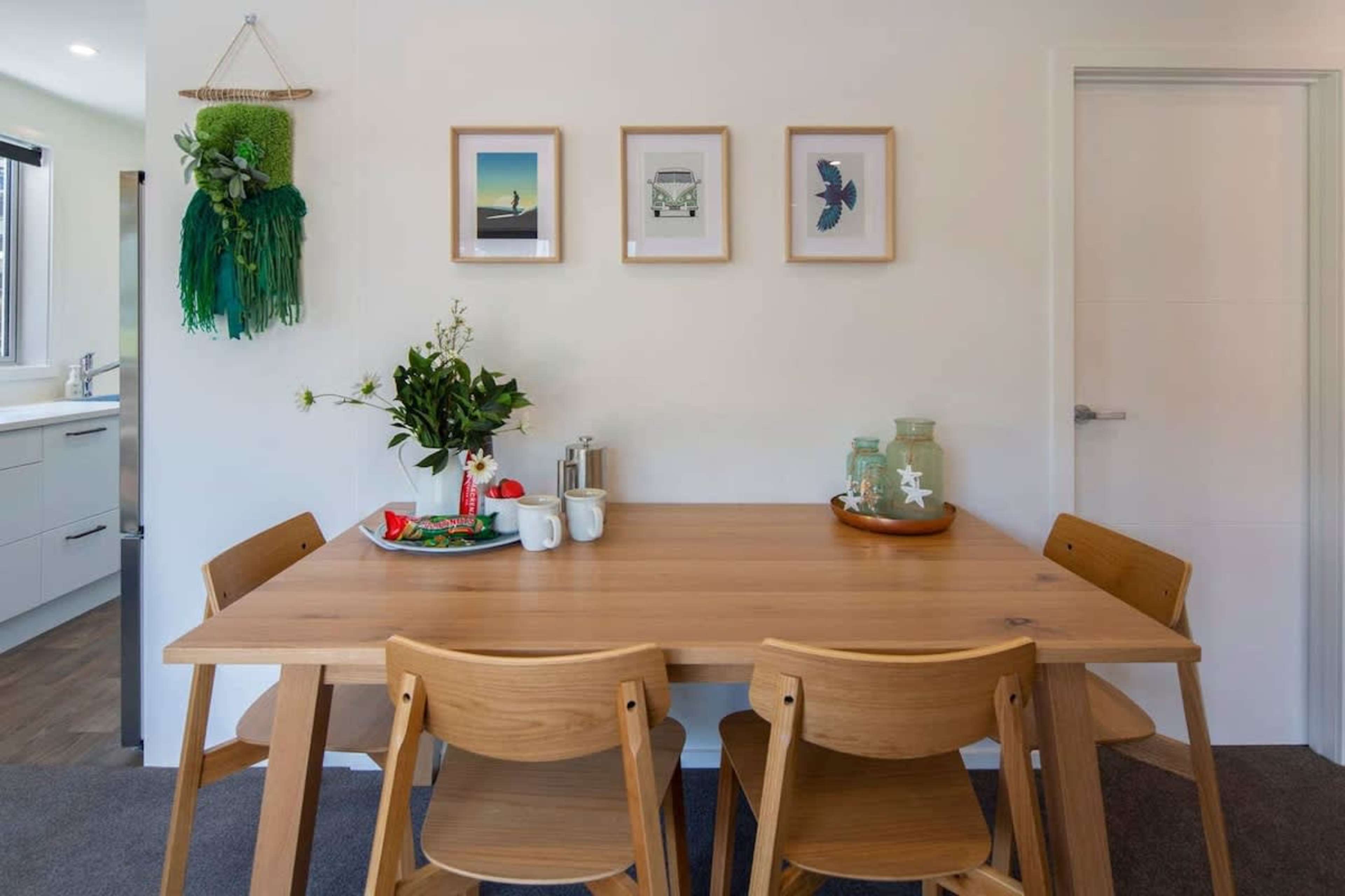 
Elegant Dining Area
The dining area offers a spacious table with comfortable seating, perfect for enjoying meals together. Whether it's a casual breakfast or a dinner gathering, this inviting space sets the tone for memorable moments.