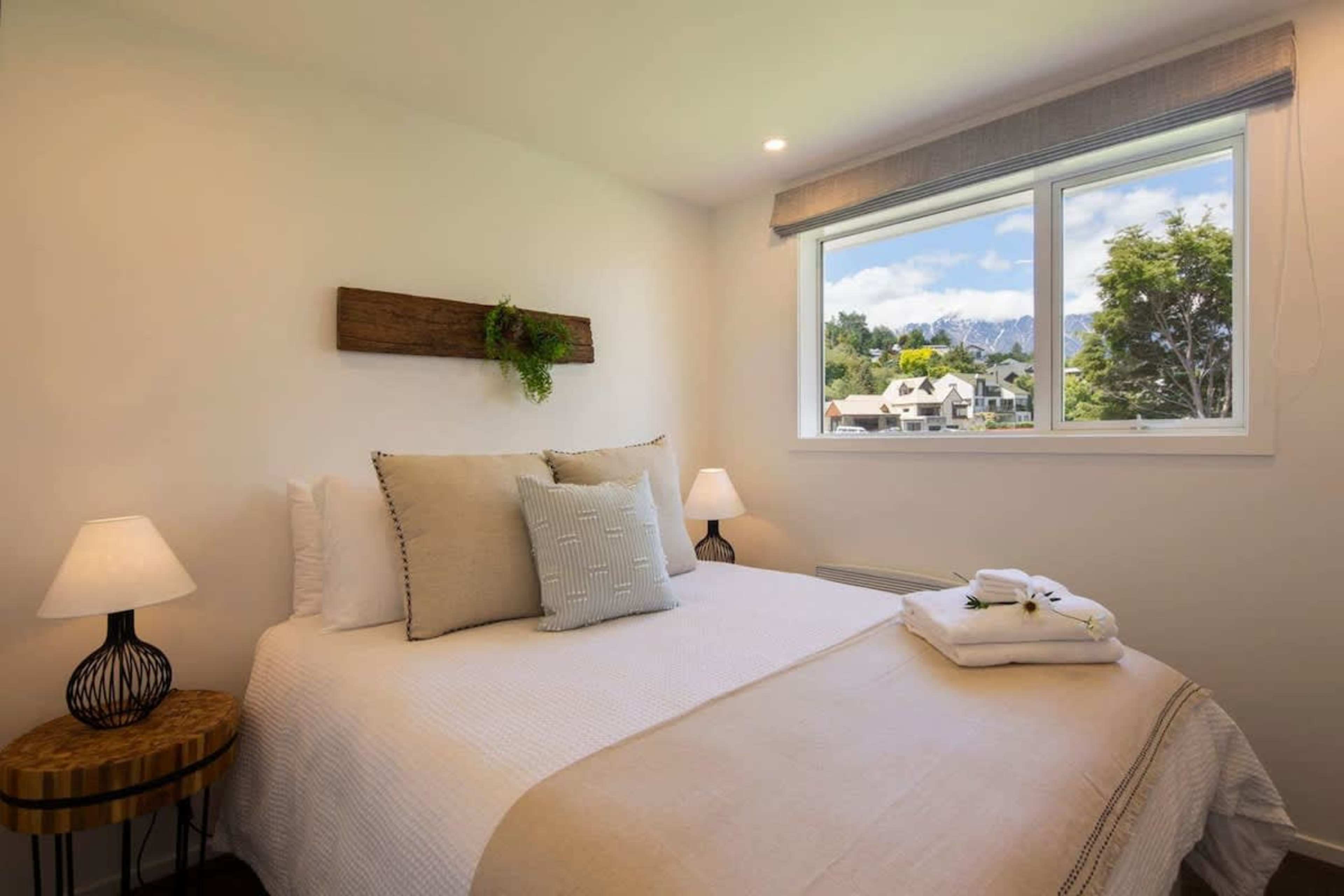 Second Bedroom with Queen Bed and Ensuite
This inviting second bedroom features a comfortable queen bed and a private ensuite. Perfect for a restful stay, it offers privacy and comfort, with all the essentials for a relaxing night’s sleep.