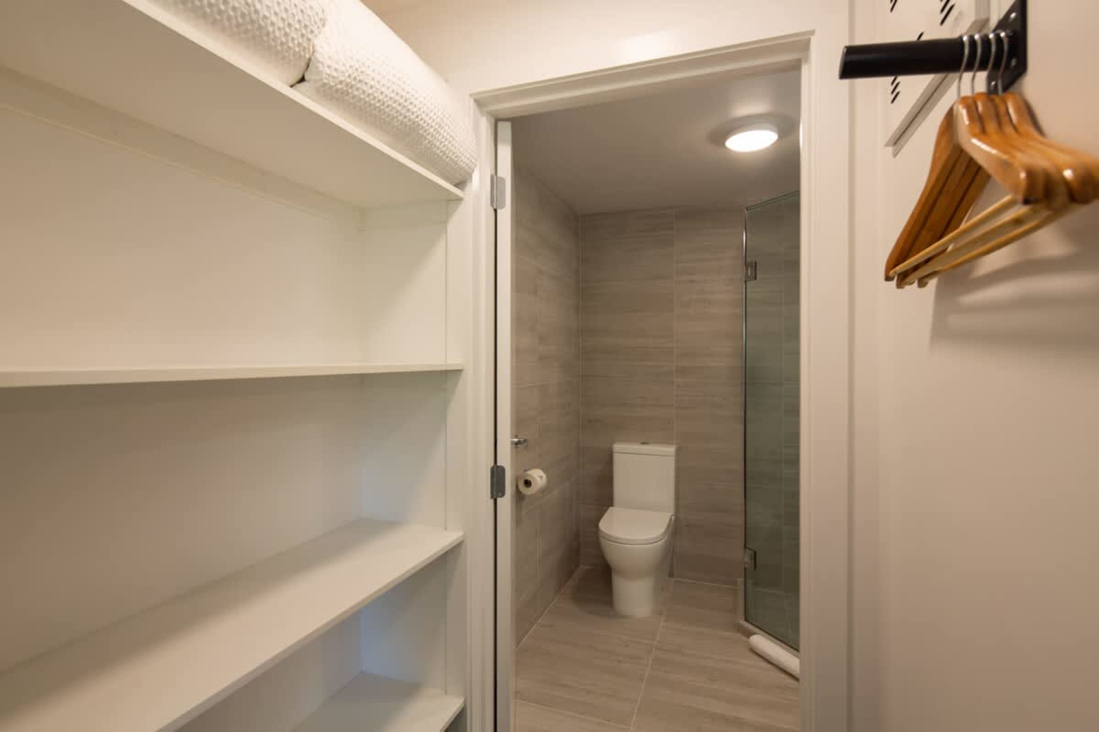 Stylish Ensuite with Shower, Heated Floors, and Ashley Products
Enjoy a walk-in shower, heated floors, and premium Ashley & Co. toiletries in this sleek ensuite. Designed for comfort, it offers a warm and relaxing space to unwind after a busy day.