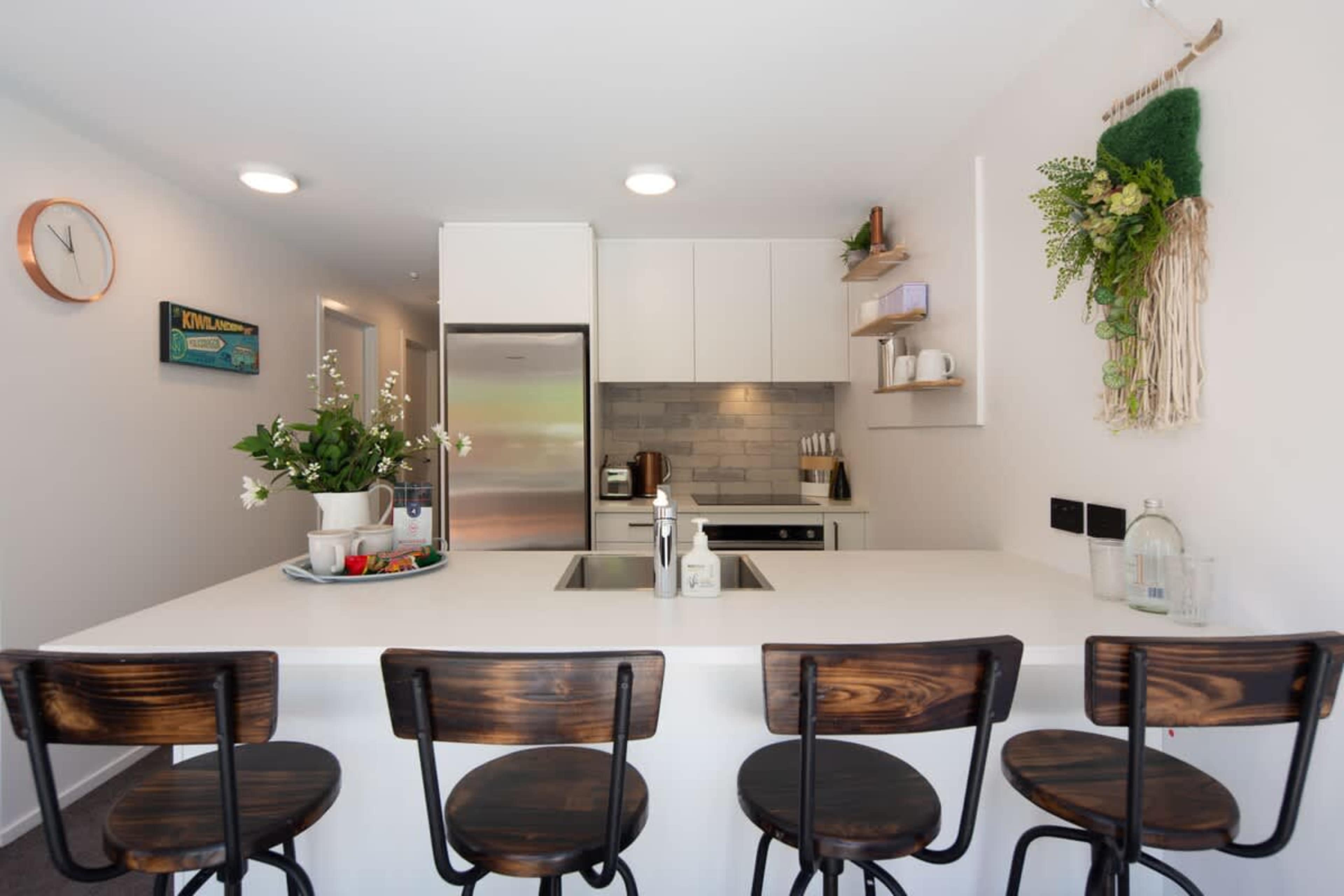 Modern Kitchen: Fully Equipped Culinary Haven
This sleek, modern kitchen features high-end appliances, ample counter space, and all the essentials you need to prepare delicious meals during your stay. 
