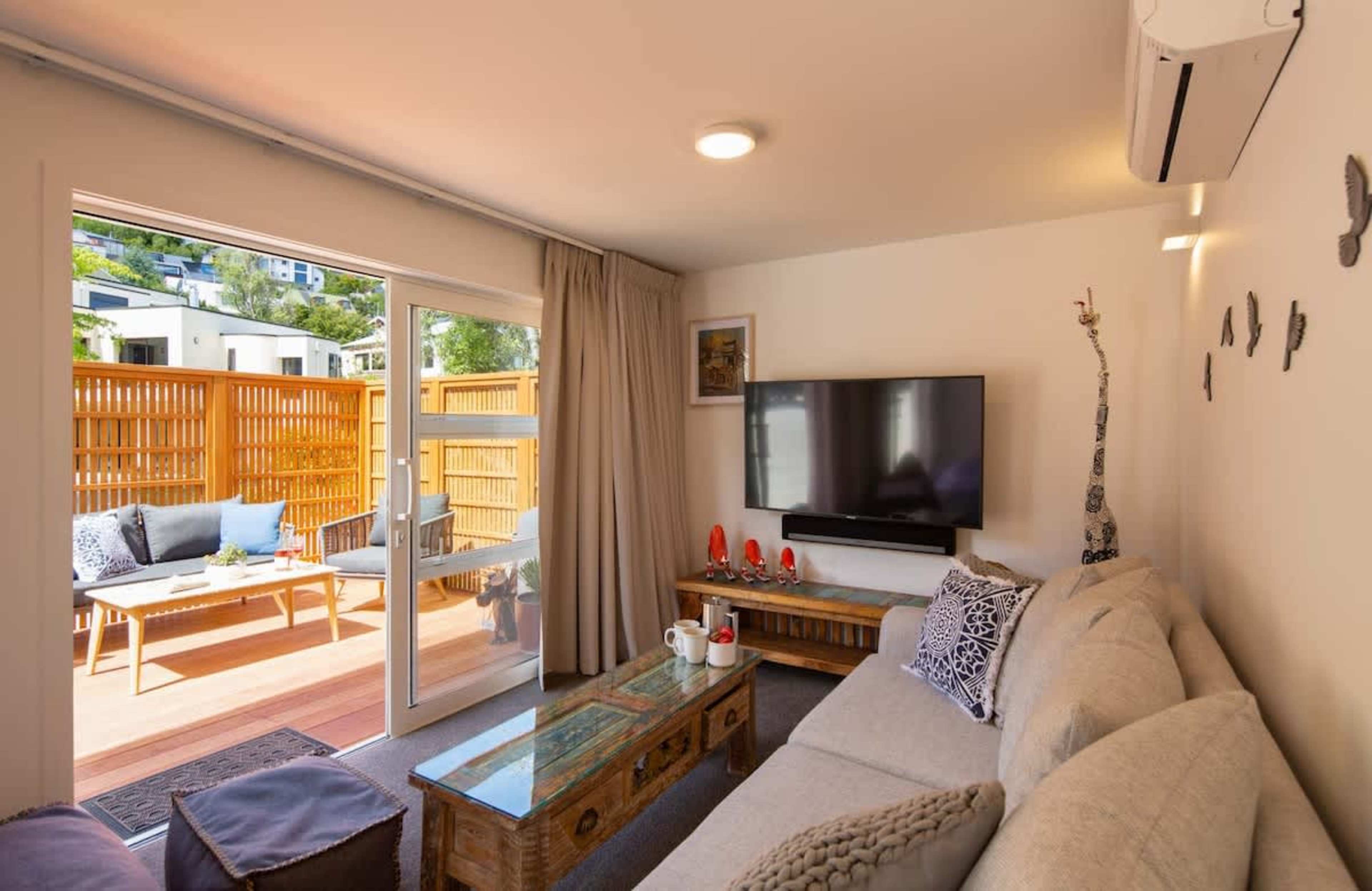 Living Room with Smart Entertainment
Relax in this cozy living room featuring modern seating, a smart TV, and a Sonos Playbar. Enjoy the warmth of underfloor heating and a heat pump, creating the perfect ambiance to unwind after a day of exploring.