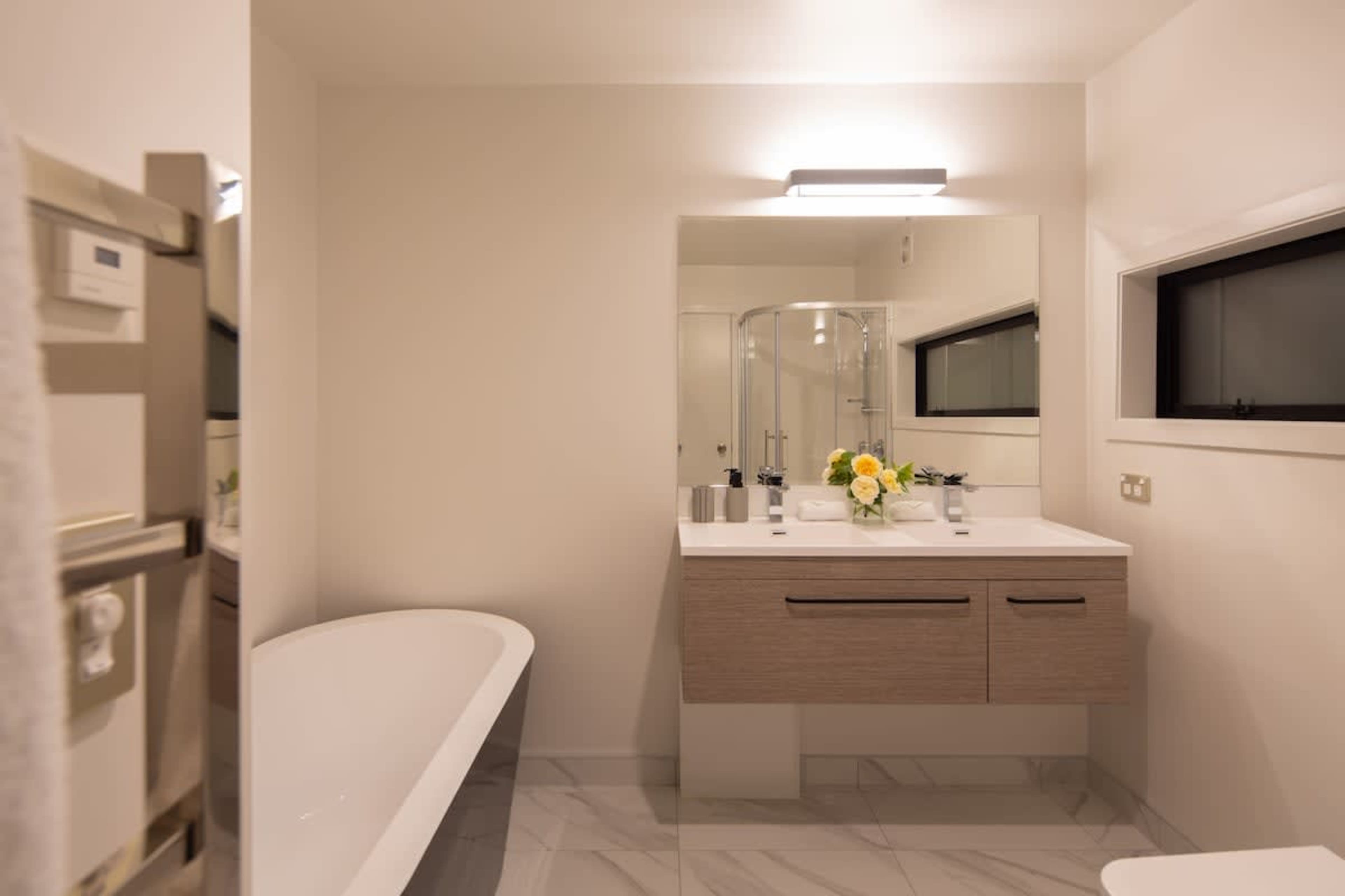 Master Ensuite with Bath and Shower
This luxurious master ensuite features both a relaxing bathtub and a spacious walk-in shower. Modern fixtures and elegant design create the perfect sanctuary for unwinding, offering comfort and convenience.