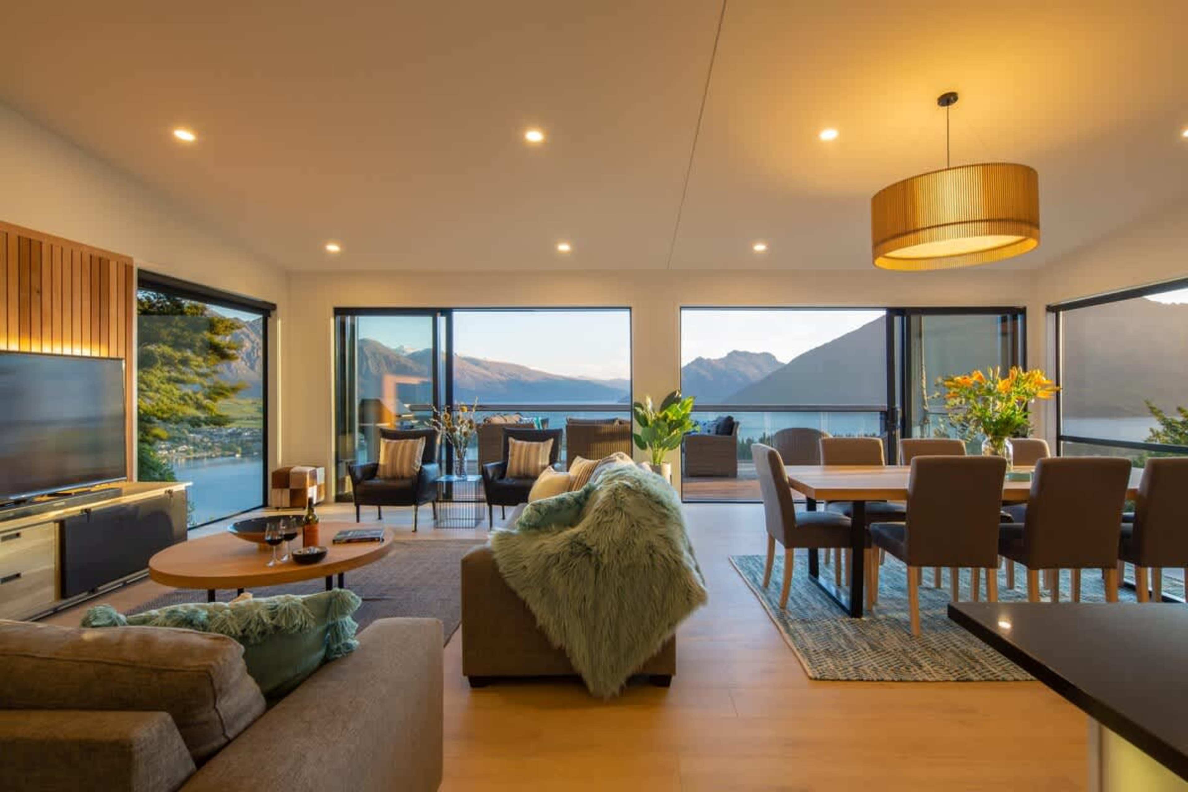 Bright and Spacious Living Room
This inviting living room boasts large windows with stunning views of Lake Wakatipu and the Remarkables. Comfortable seating and stylish decor create the perfect atmosphere to unwind or entertain in style.