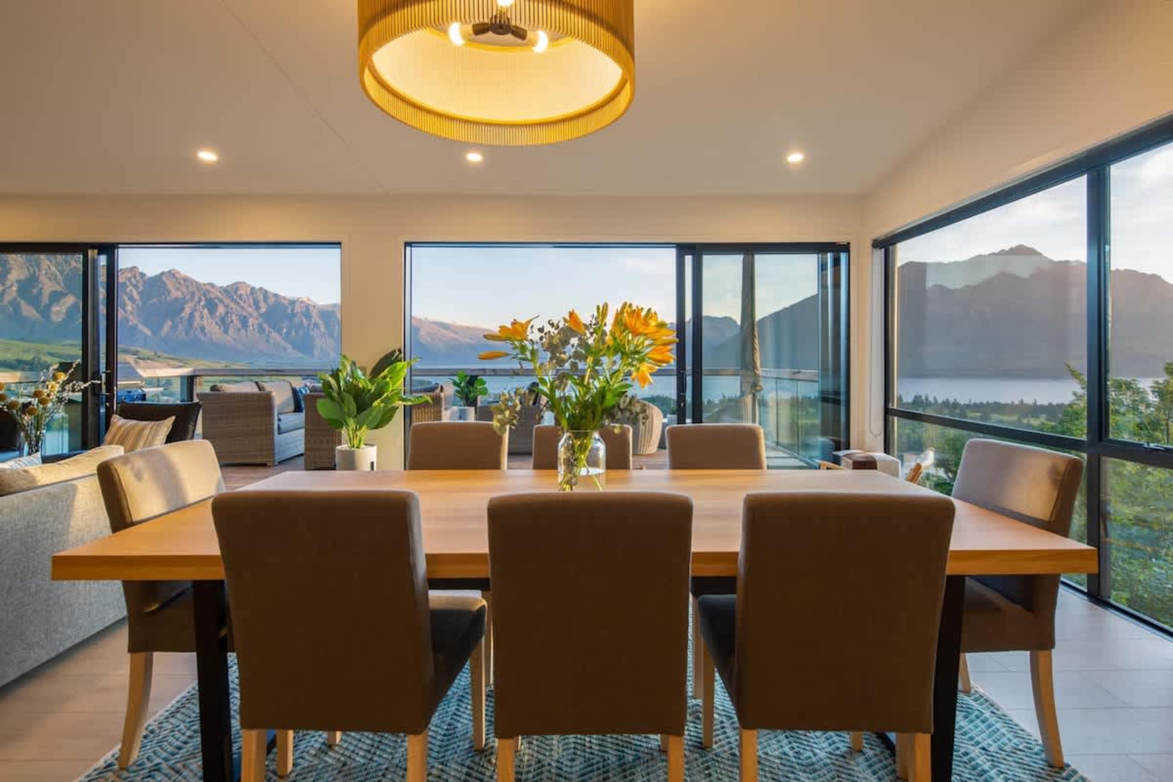 Bright Dining Room with Lake Views
Dine in this beautiful room with a large table, perfect for shared meals. Enjoy stunning views of Lake Wakatipu and the Remarkables through the expansive windows, offering the perfect setting for any meal.