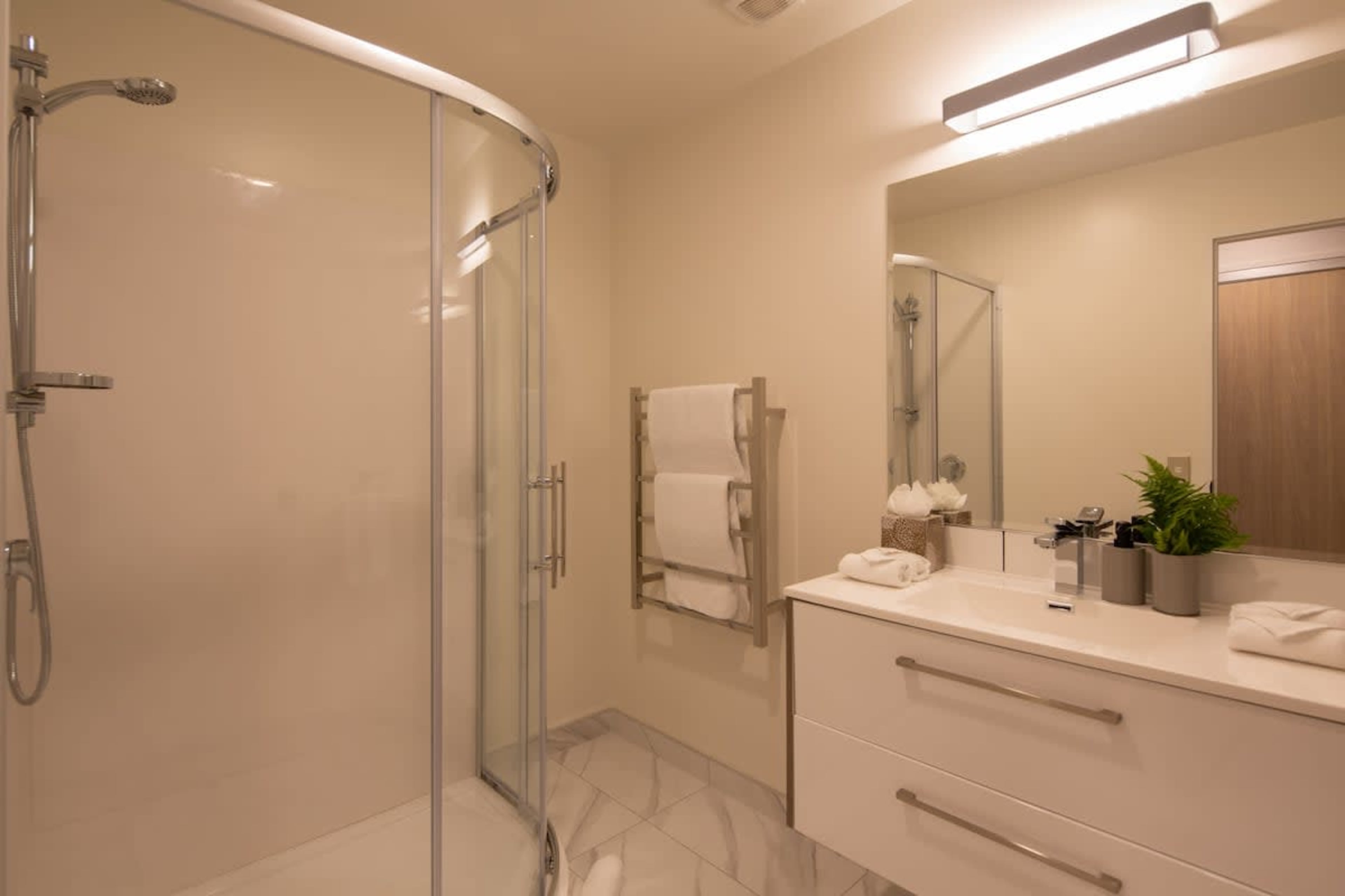 This modern second bathroom features a spacious walk-in shower and is stocked with luxurious Ashley & Co. toiletries. Thoughtfully designed for comfort and convenience, it’s the perfect place to refresh after a day of adventure.