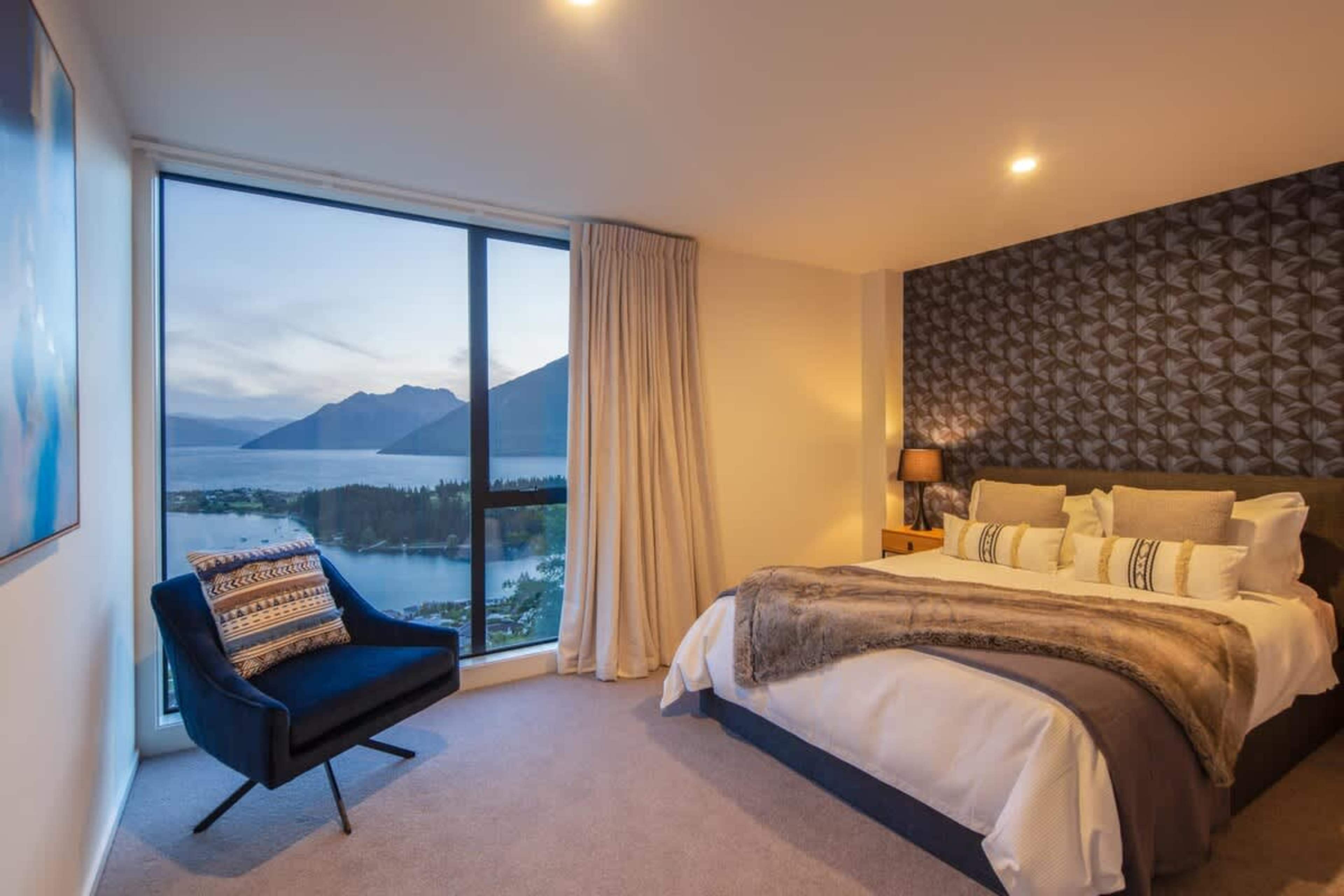 Comfortable Bedroom with Lake Views
This spacious third bedroom is perfect for your comfort, and stunning views of Lake Wakatipu. With modern decor and ample storage, it’s an ideal space for a restful night’s sleep.