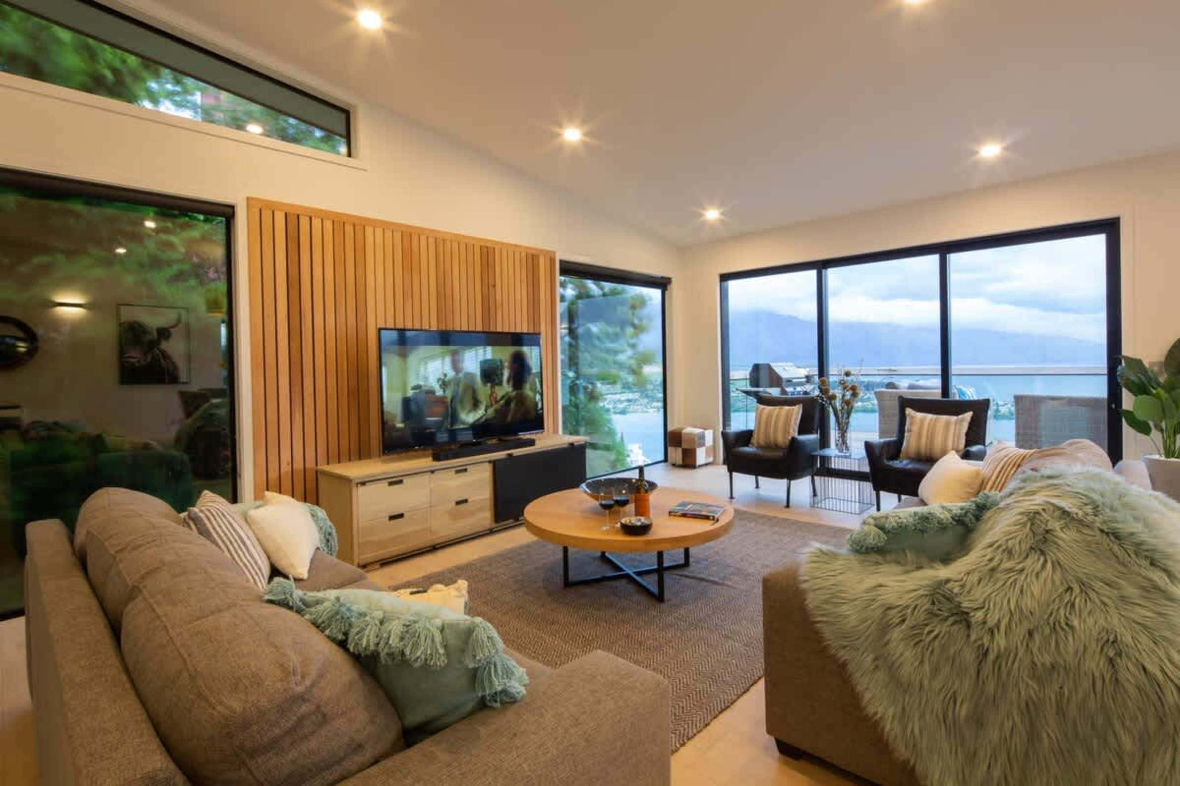 Luxurious Living Room with Views
Unwind in the spacious living room, featuring stylish furnishings and large windows showcasing panoramic lake and mountain views. It’s the perfect space to relax, entertain, or simply enjoy the beauty of Queenstown.