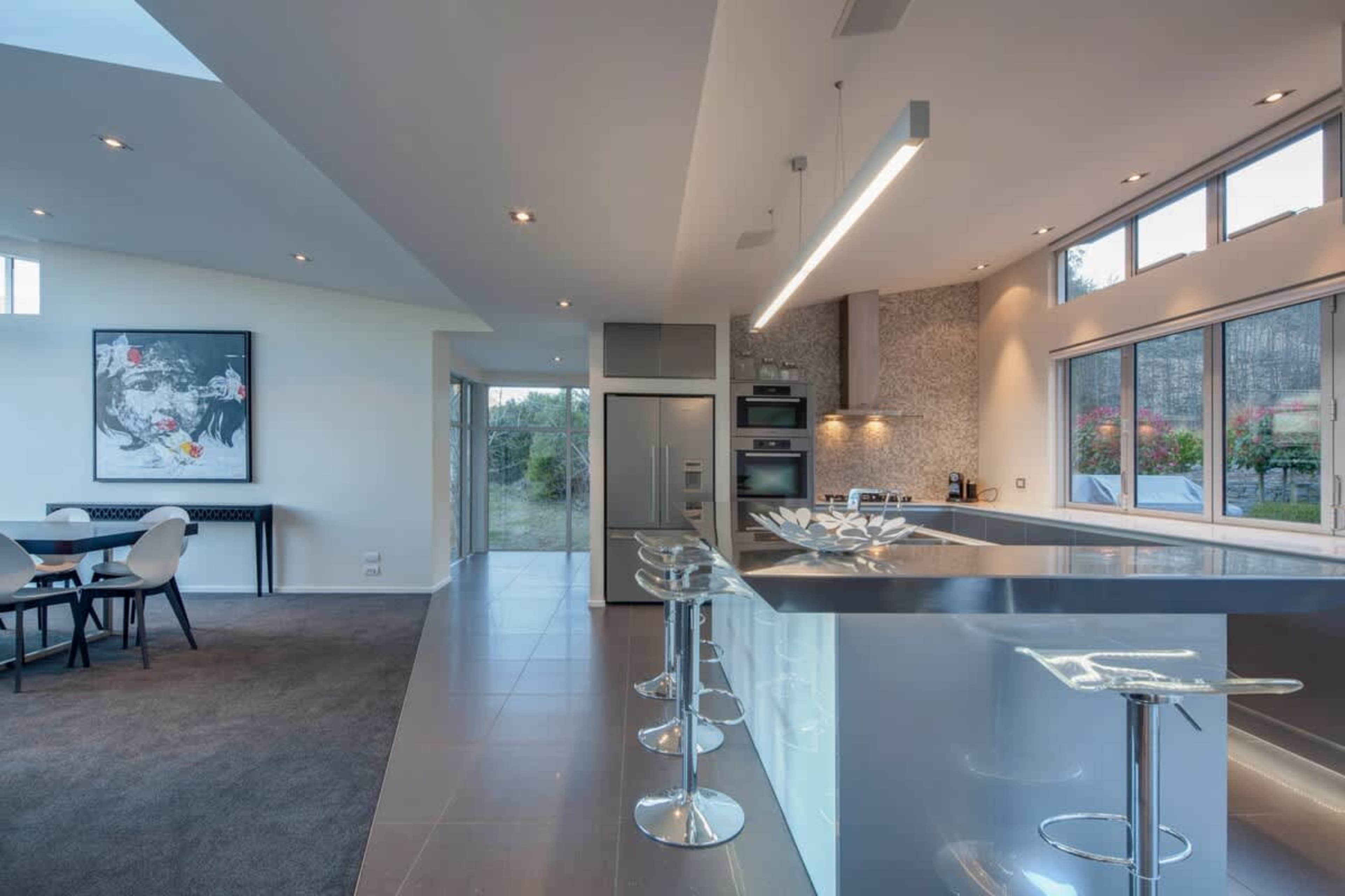 Open kitchen, dining, and lounge area in our Queenstown luxury accommodation