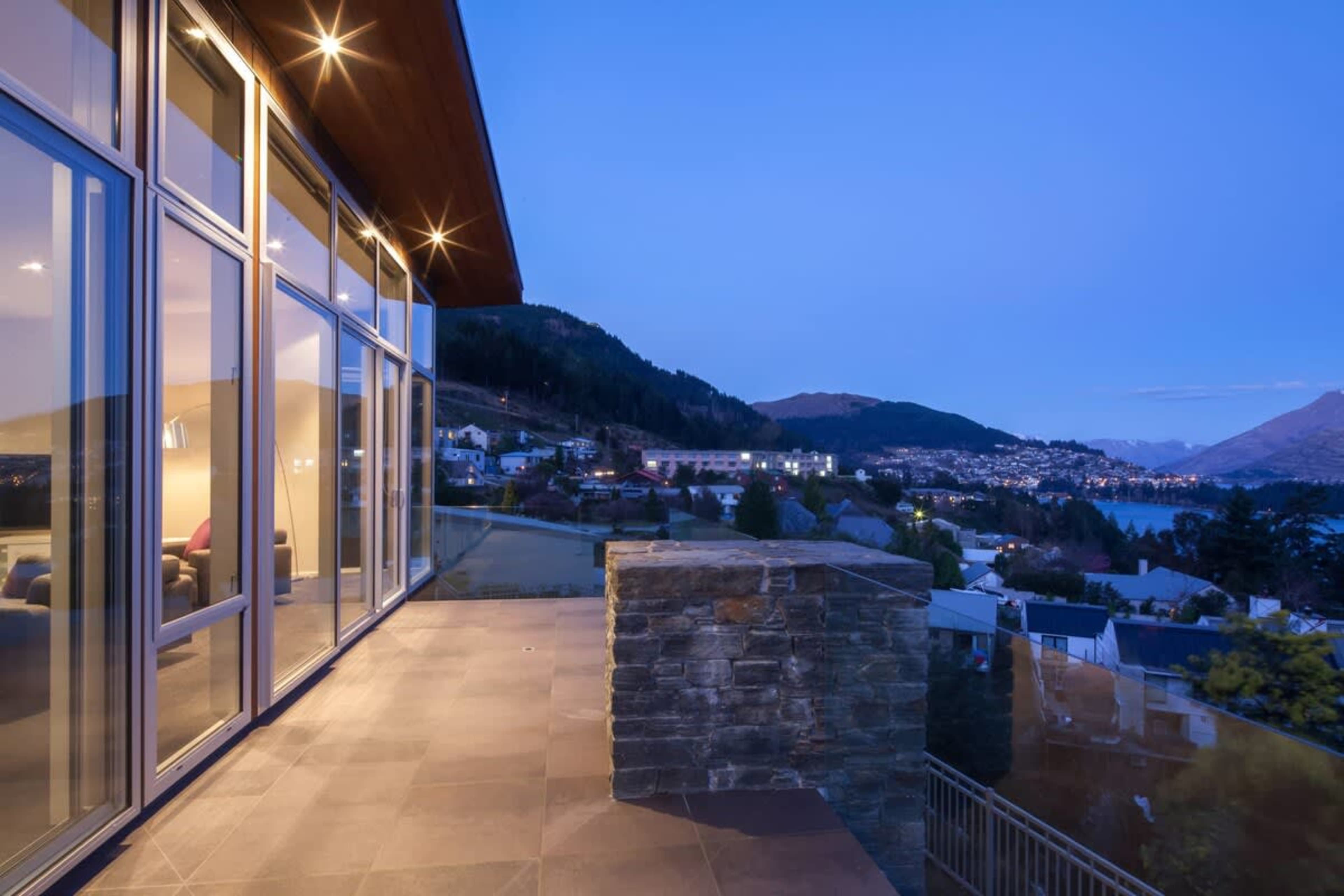 Dusk views over the town and lake from our luxury accommodation, New Zealand