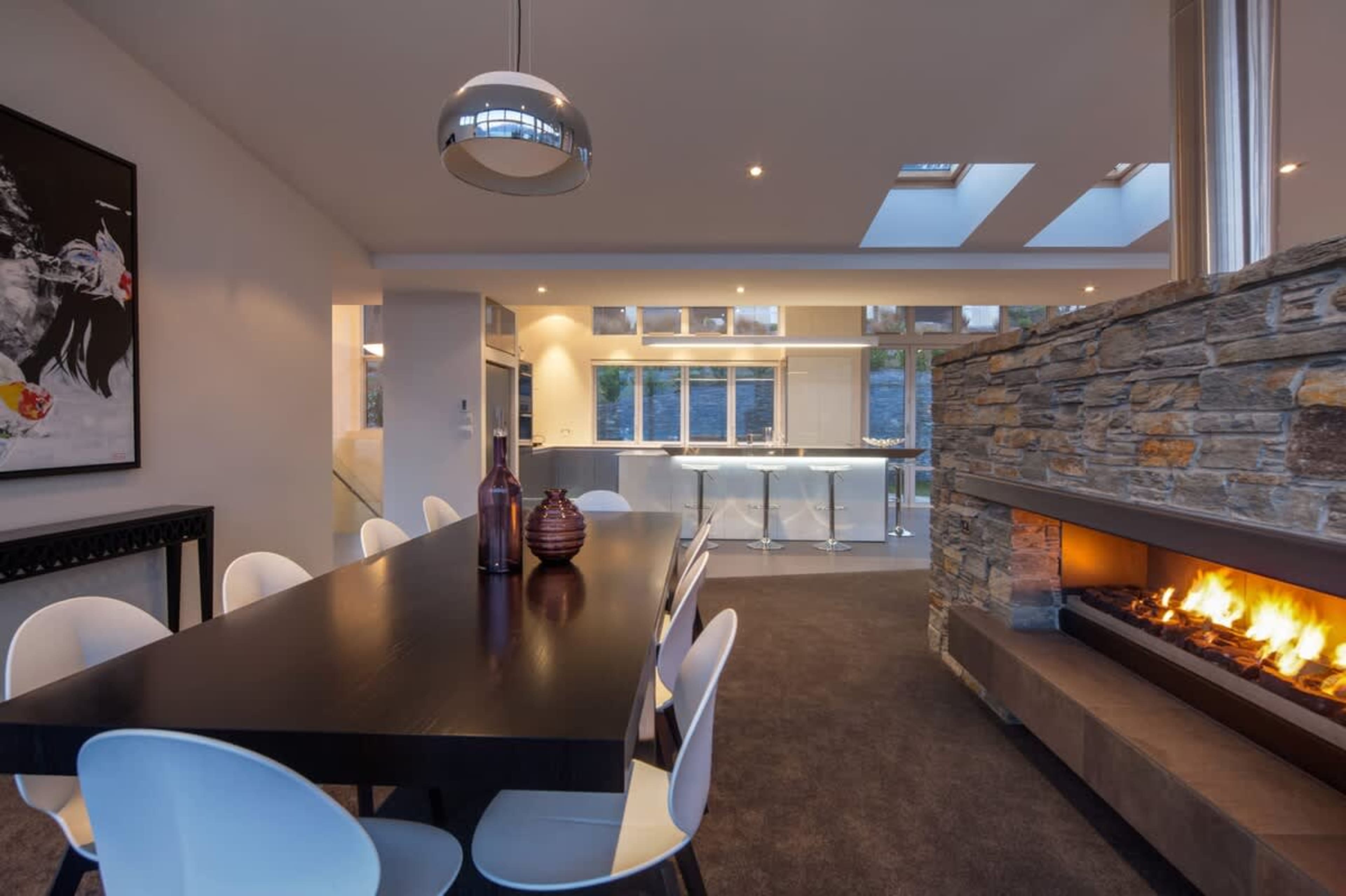 Dining beside a roaring fire at one of Queenstown's best accommodation