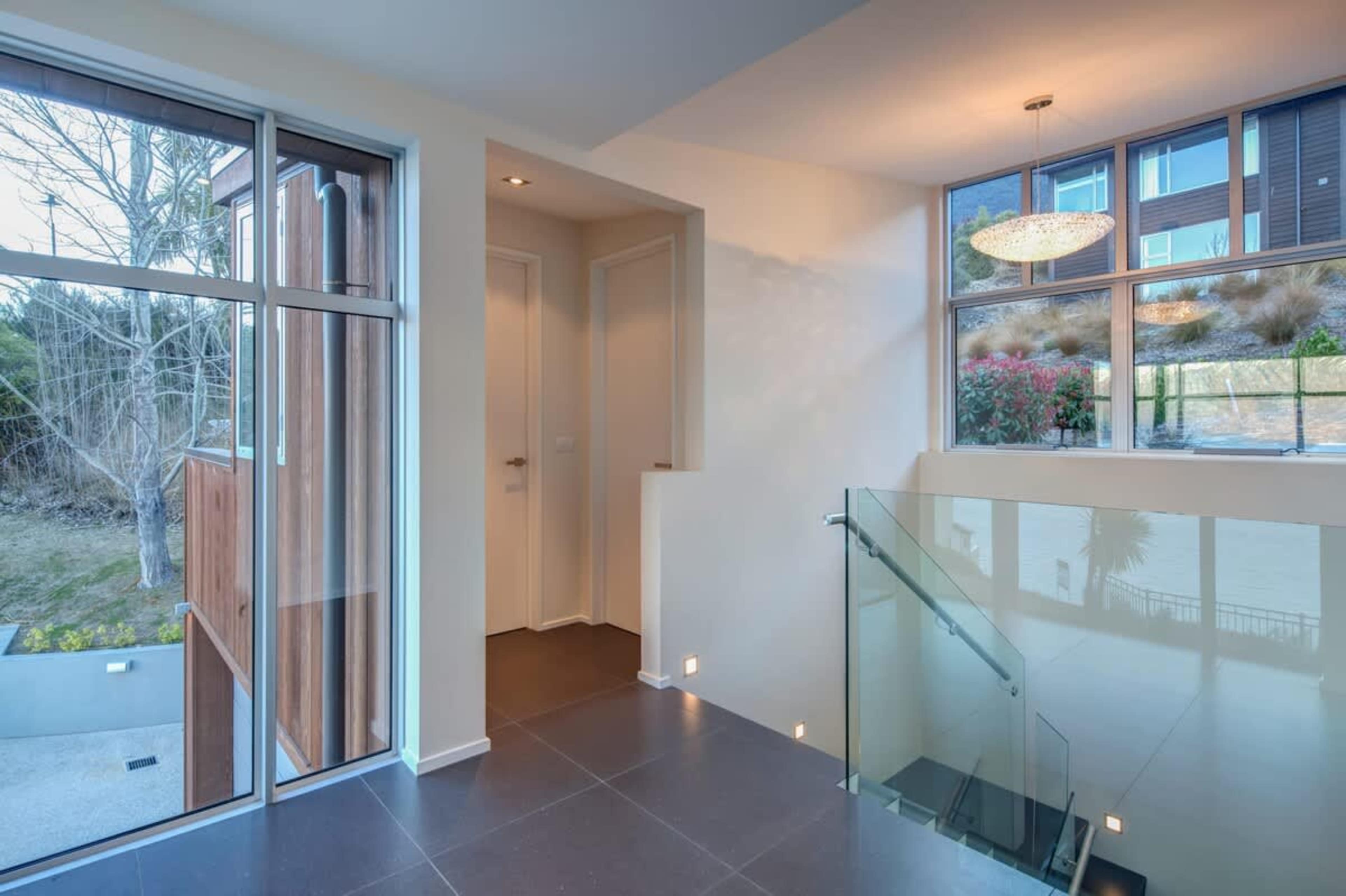 Elegant foyer leading downstairs - New Zealand luxury lodges