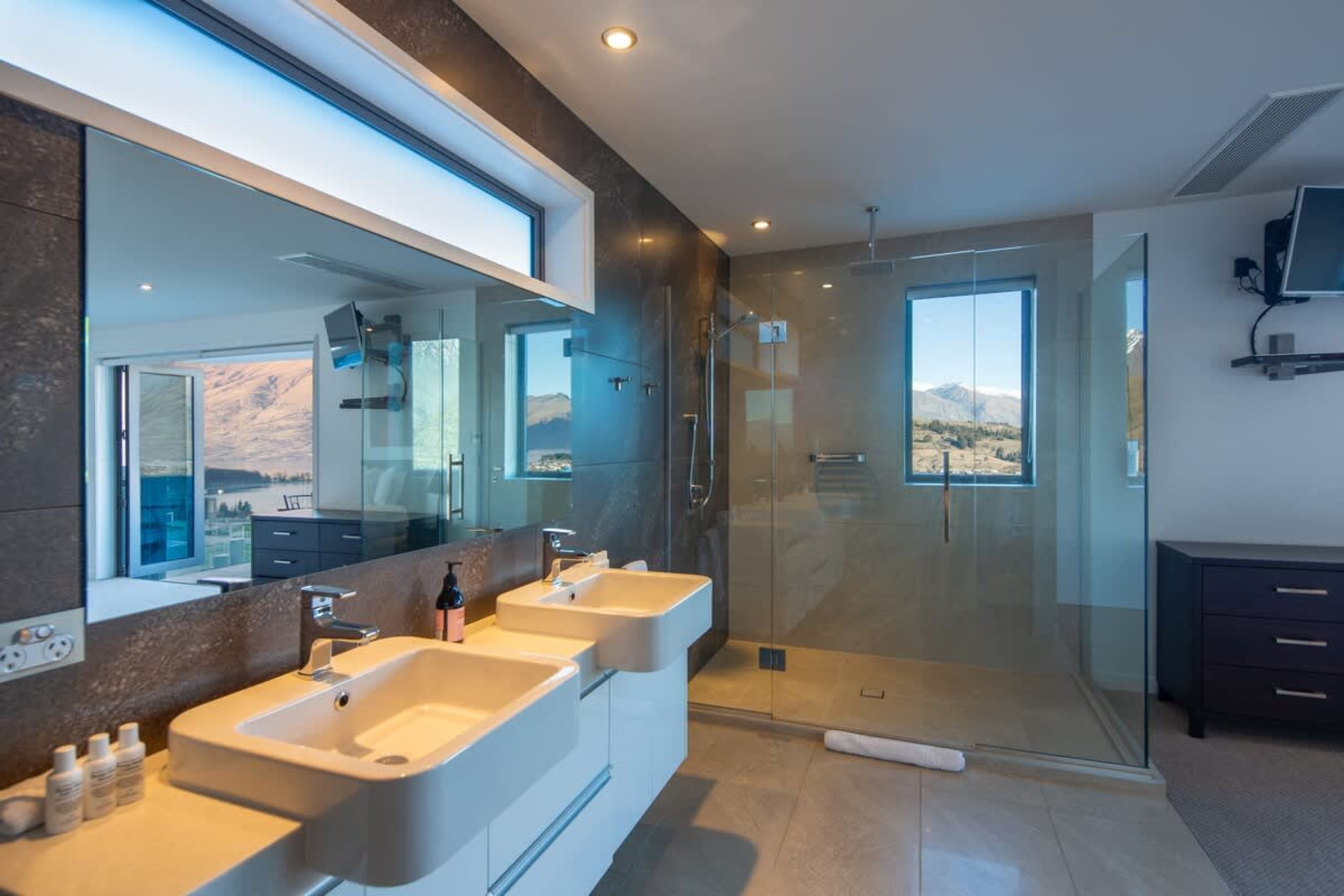 Luxurious Master Bathroom with Dual Sinks and Walk-In Shower – Experience ultimate comfort in this spacious master bathroom featuring elegant his and her sinks and a modern walk-in shower, designed for relaxation and convenience.