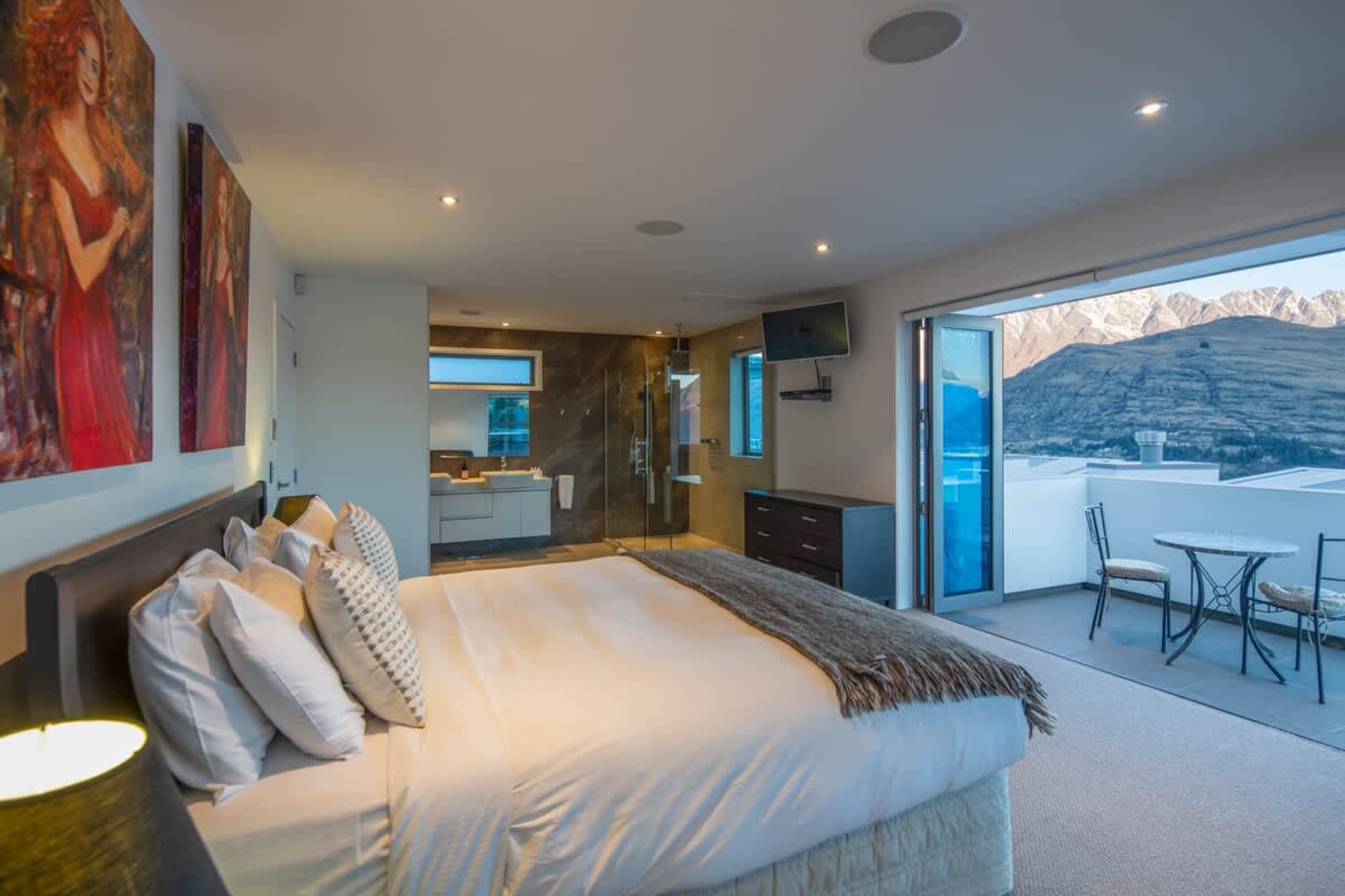 Tranquil Master Suite with Scenic Balcony – Unwind in this spacious master bedroom featuring a private balcony with stunning views, offering the perfect setting for peaceful moments and relaxation.