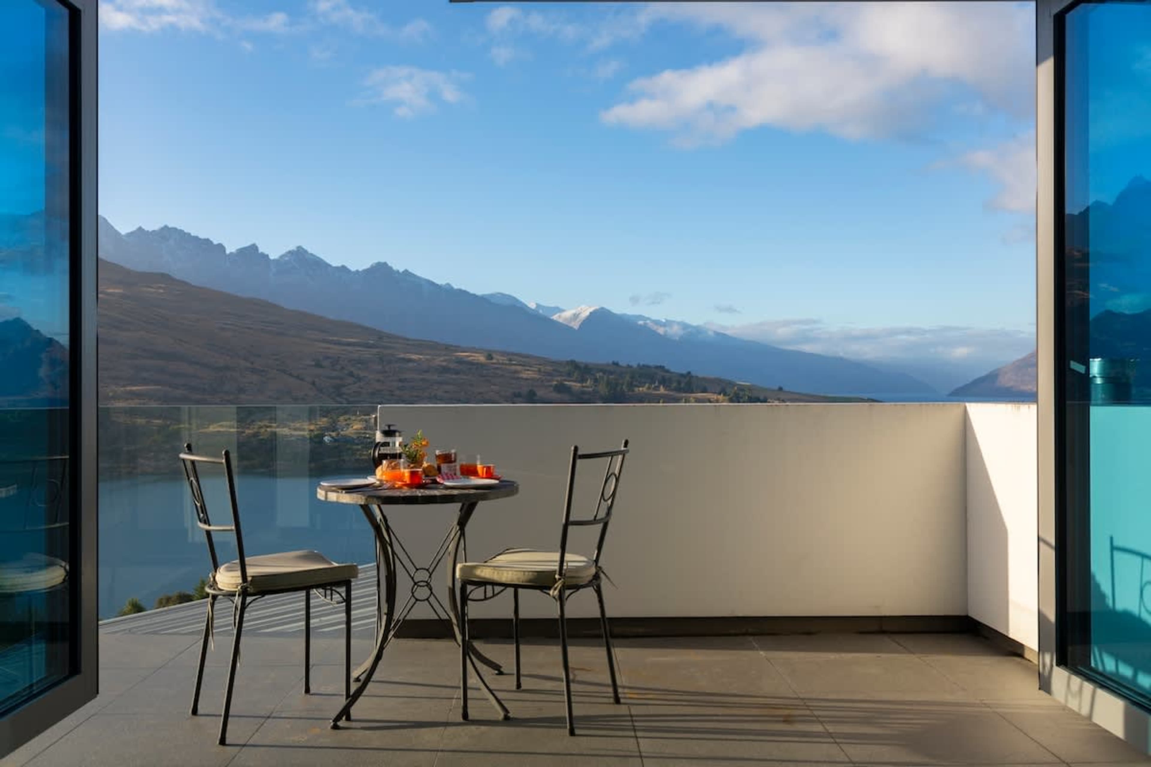 A Peaceful Escape
Unwind on the master bedroom’s private patio, designed for intimate moments surrounded by nature. Whether savoring your morning coffee or an evening wine, the serene lake and mountain views.