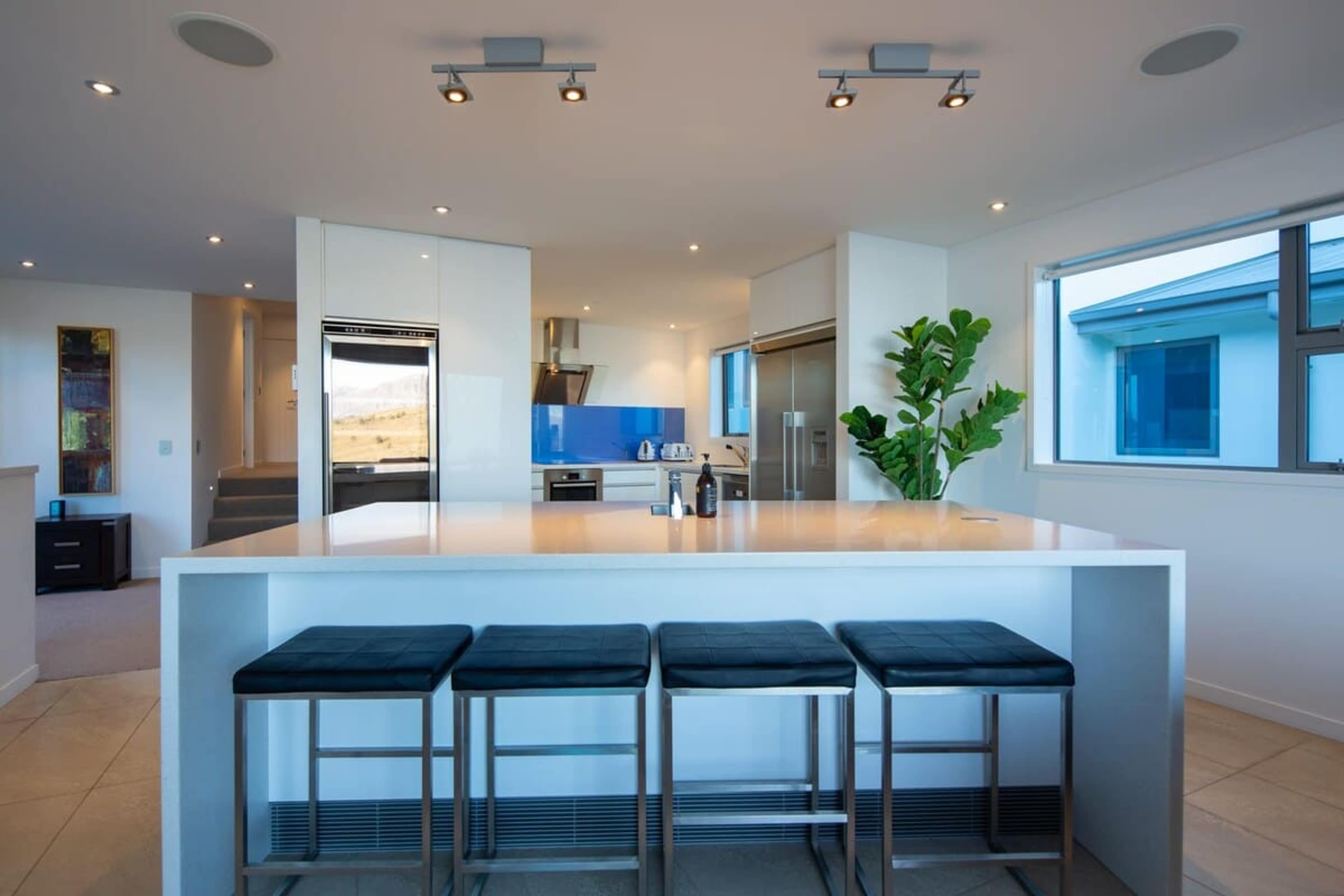 Fully Equipped Gourmet Kitchen – Cook and entertain with ease in this modern kitchen featuring high-end appliances, ample counter space, and all the essentials for a culinary experience.