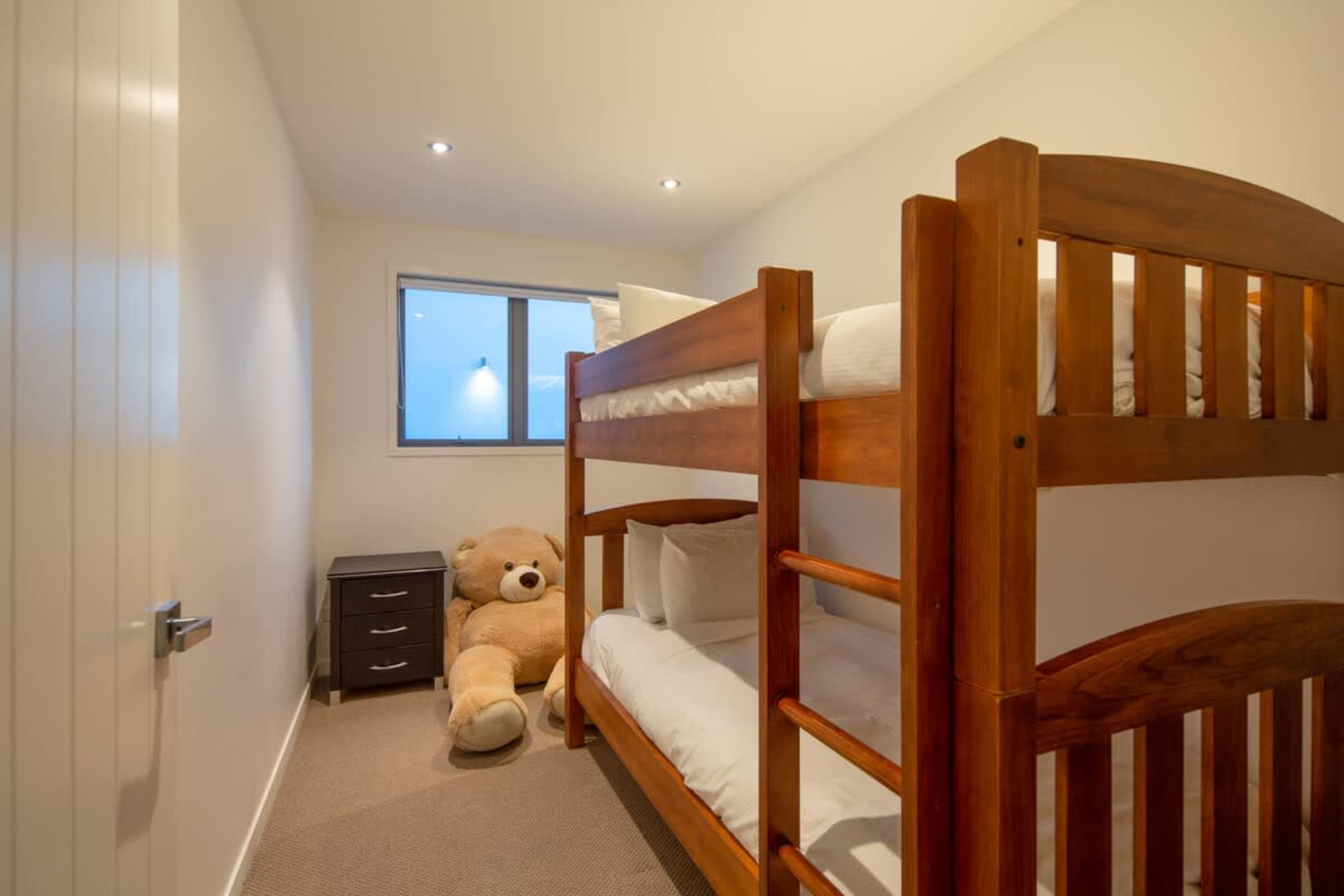 Fun-Filled Fifth Bedroom with Bunk Beds – This playful fifth bedroom features cozy bunk beds, making it the perfect space for kids or friends to enjoy a comfortable and fun sleepover experience.