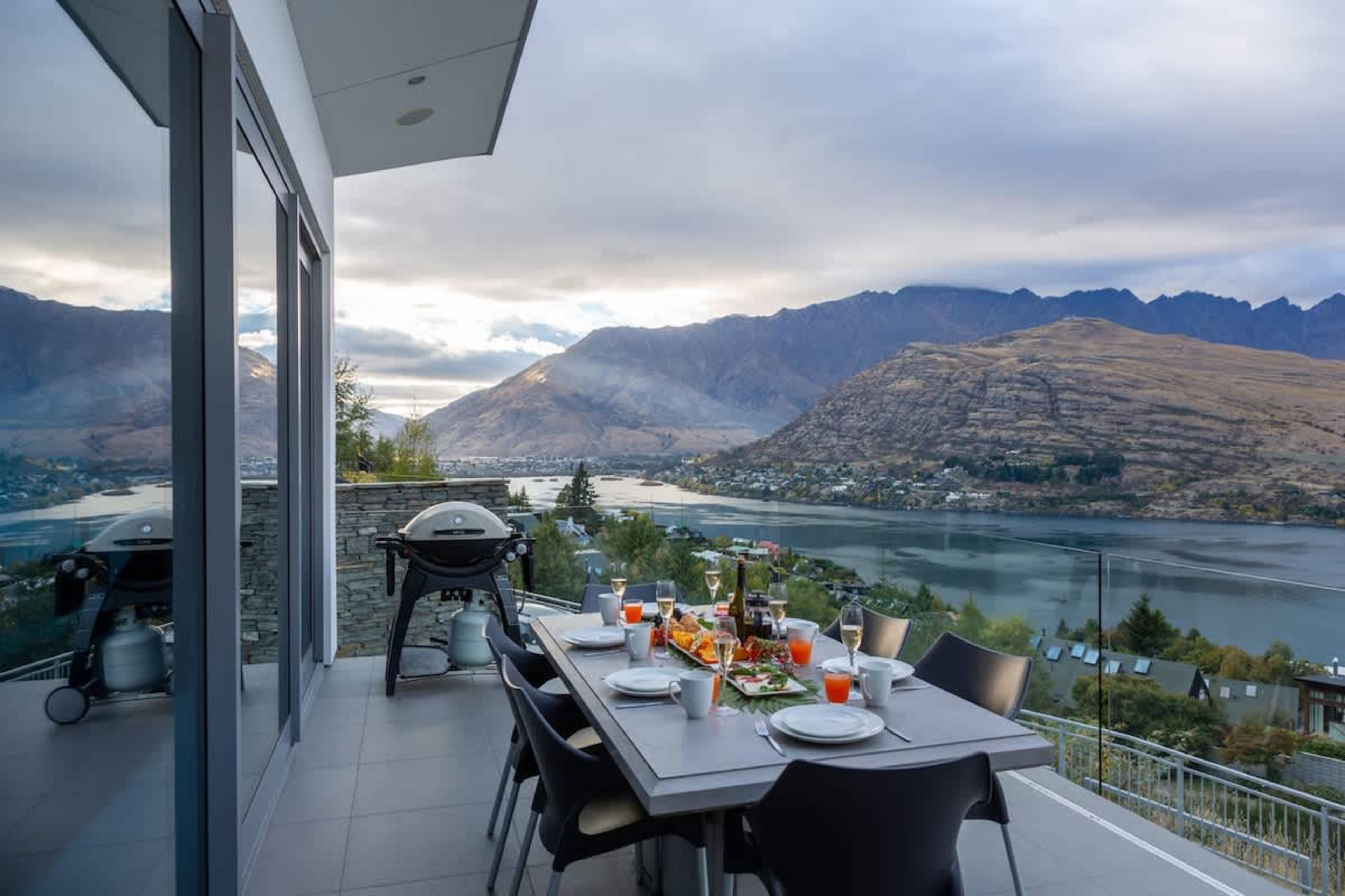 Luxury Outdoor Living – Immerse yourself in breathtaking scenery from this impeccably designed balcony, ideal for alfresco dining or unwinding after a day of Queenstown exploration.