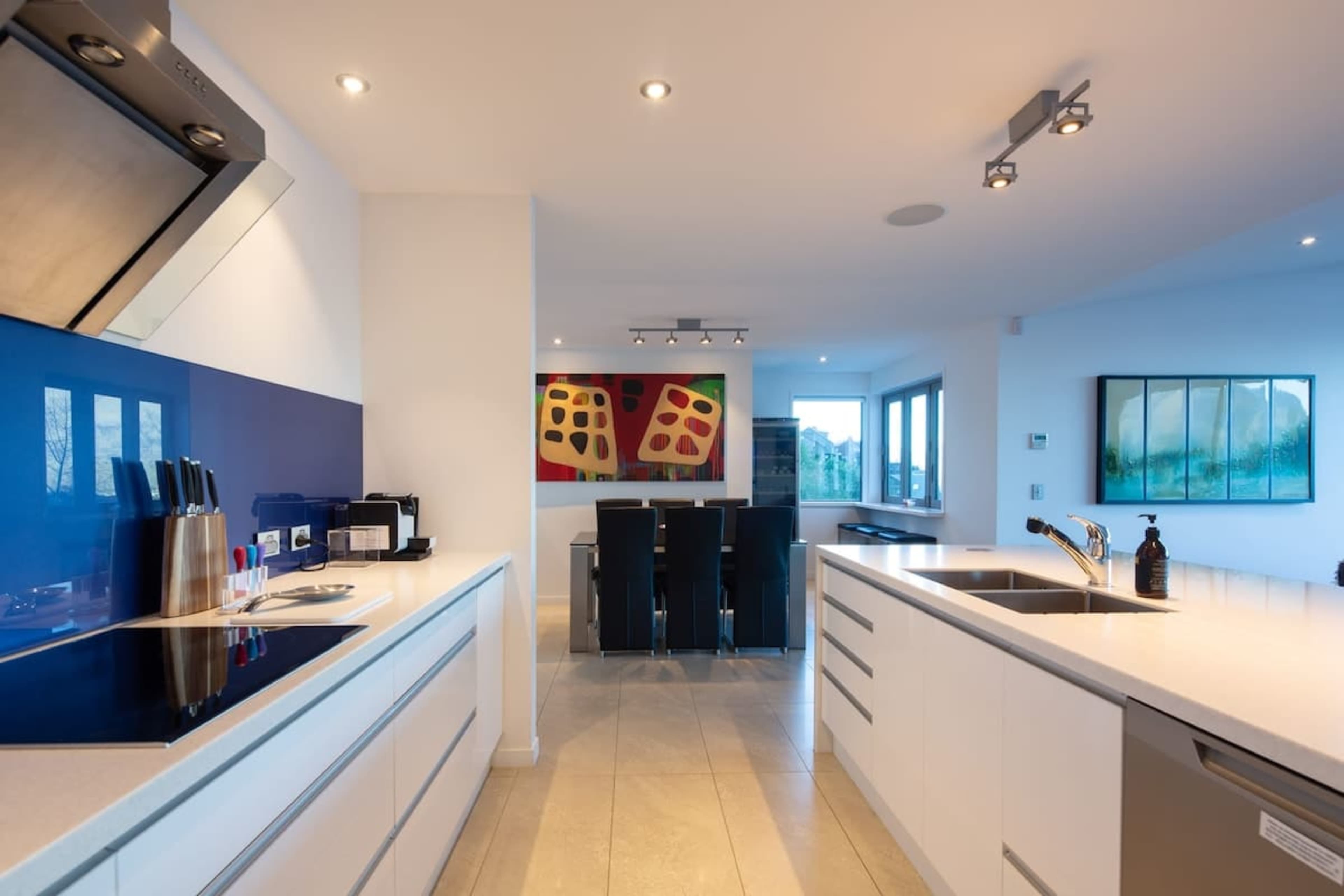 Modern Gourmet Kitchen with Nespresso Machine – Start your day with a freshly brewed cup of coffee from the sleek Nespresso machine in this fully equipped, state-of-the-art kitchen, perfect for culinary enthusiasts.