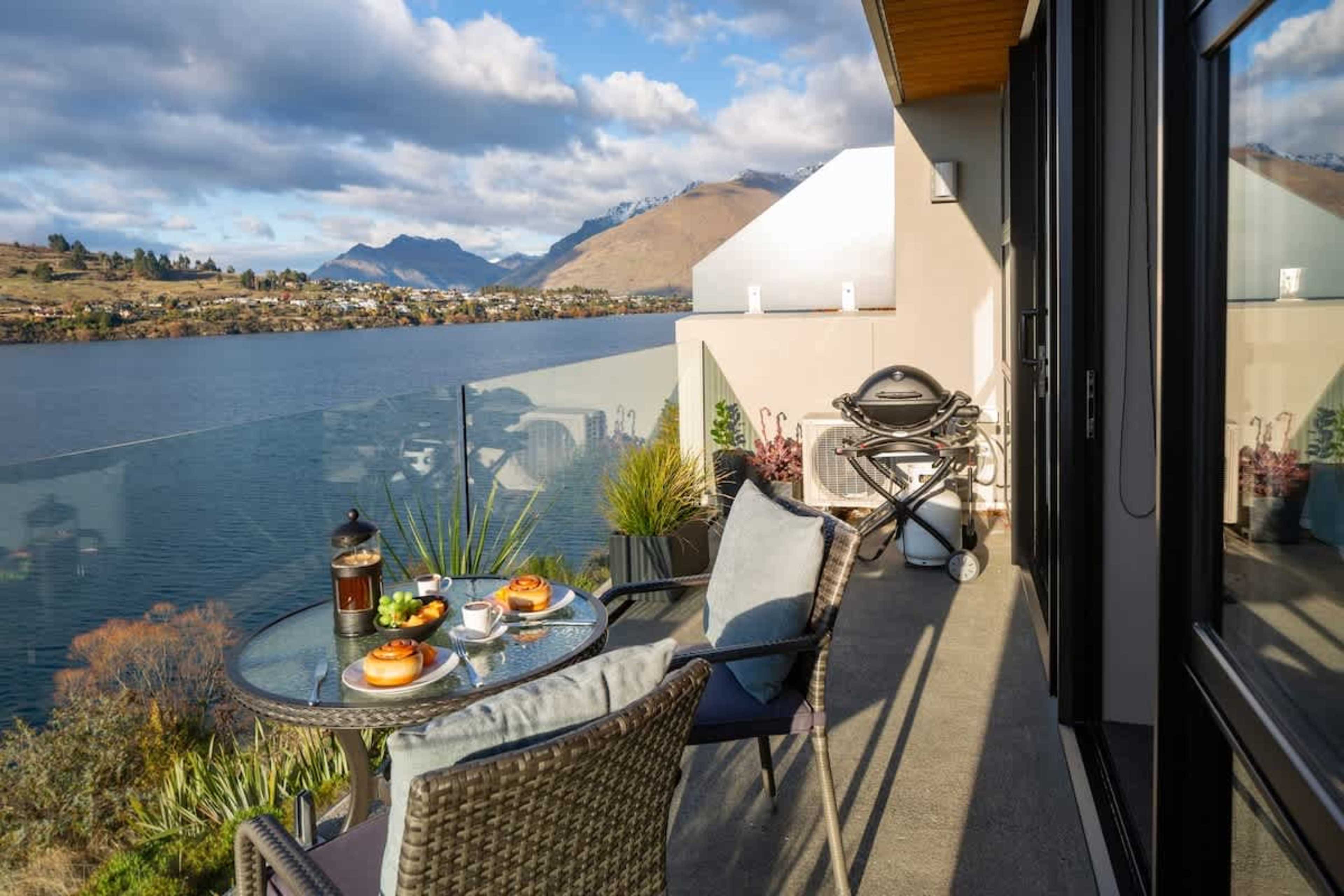 Scenic Patio Retreat – Enjoy your own slice of paradise with a private patio, BBQ for cooking, and unparalleled views of the lake and mountains.