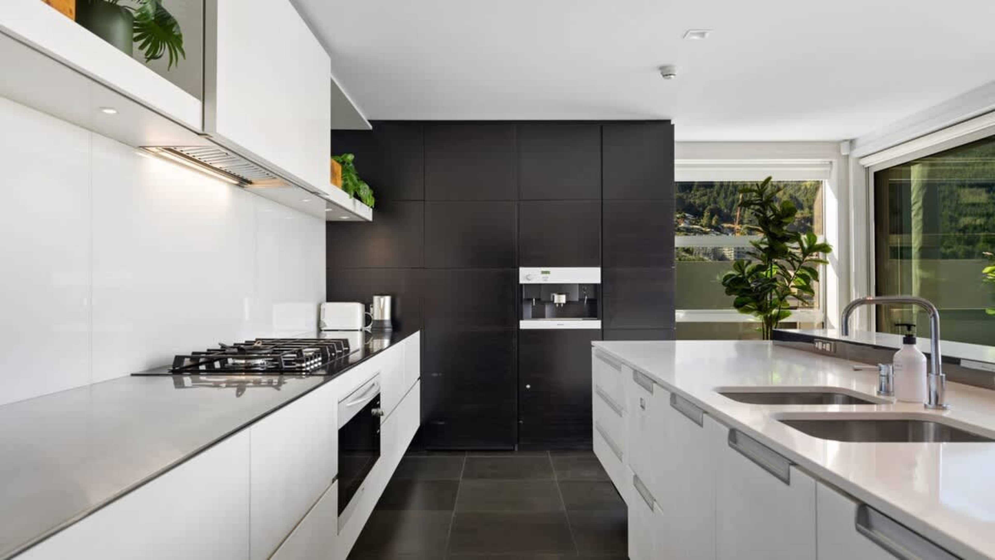 Luxury Culinary Space
Enjoy preparing meals in this gourmet kitchen, equipped with the latest appliances and elegant finishes, ideal for both casual cooking and entertaining in Queenstown.