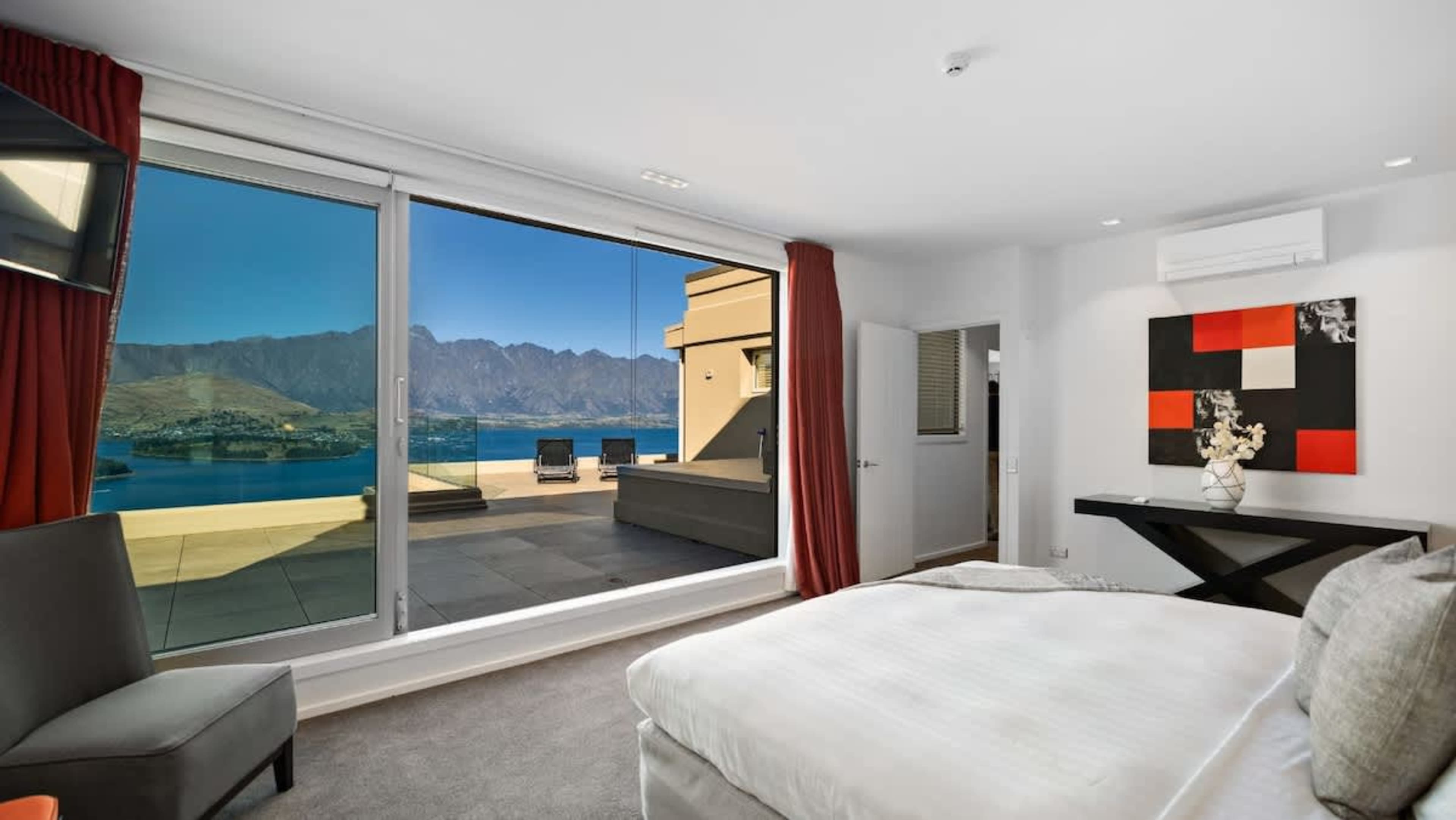Spacious Second Bedroom
Enjoy comfort and tranquility in the second bedroom, featuring elegant furnishings and ample space, perfect for a restful night’s sleep with views of Queenstown’s stunning scenery.