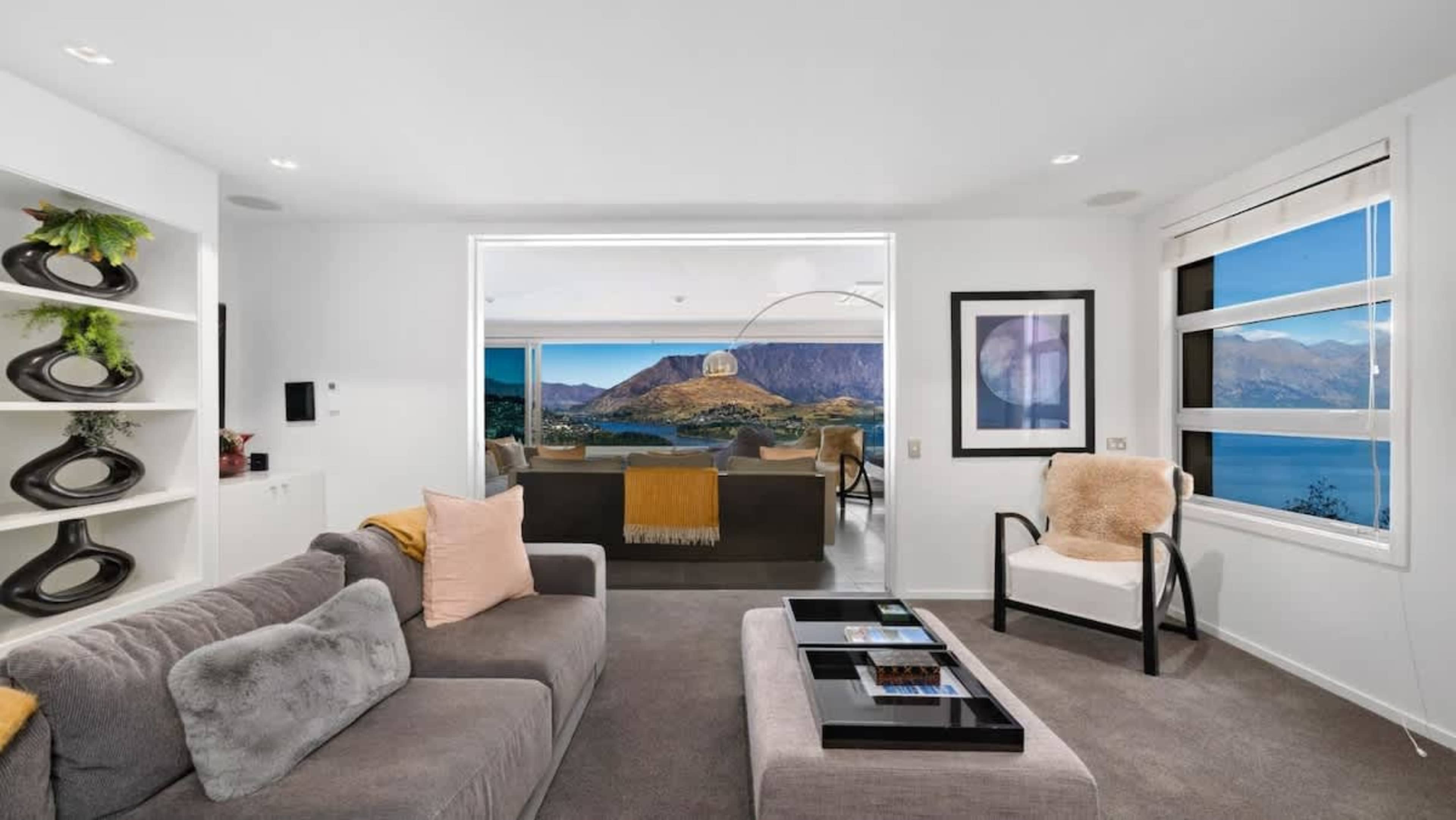 Second Living Room Retreat
Unwind in the stylish second living room, offering a cozy yet sophisticated space with comfortable seating and views of Queenstown’s stunning landscape, perfect for relaxation or intimate gatherings.