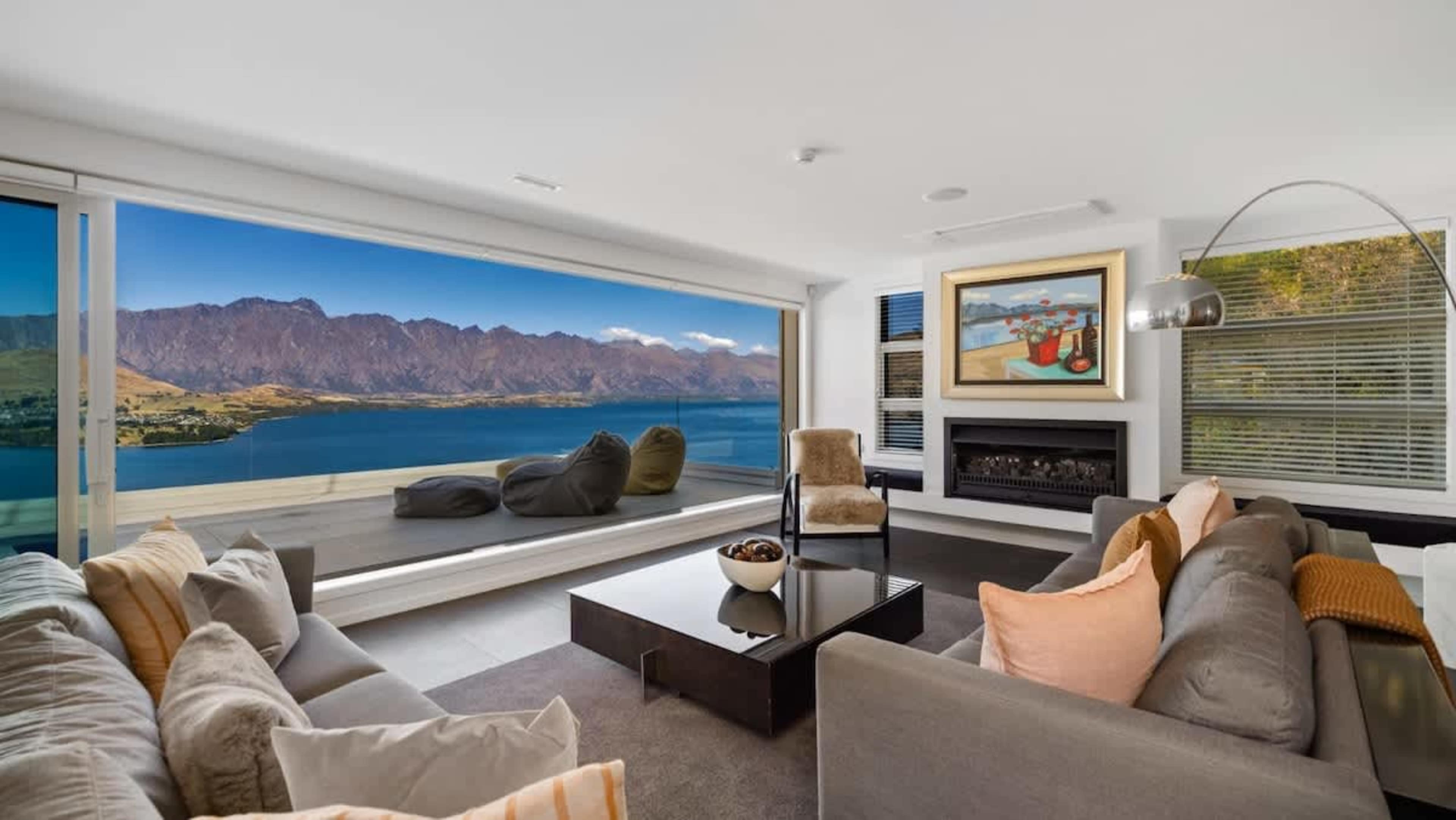 Grand Living Room
Step into the expansive living room of Lorden’s Penthouse, where luxury meets comfort, featuring panoramic views and opulent furnishings for an unforgettable Queenstown experience.