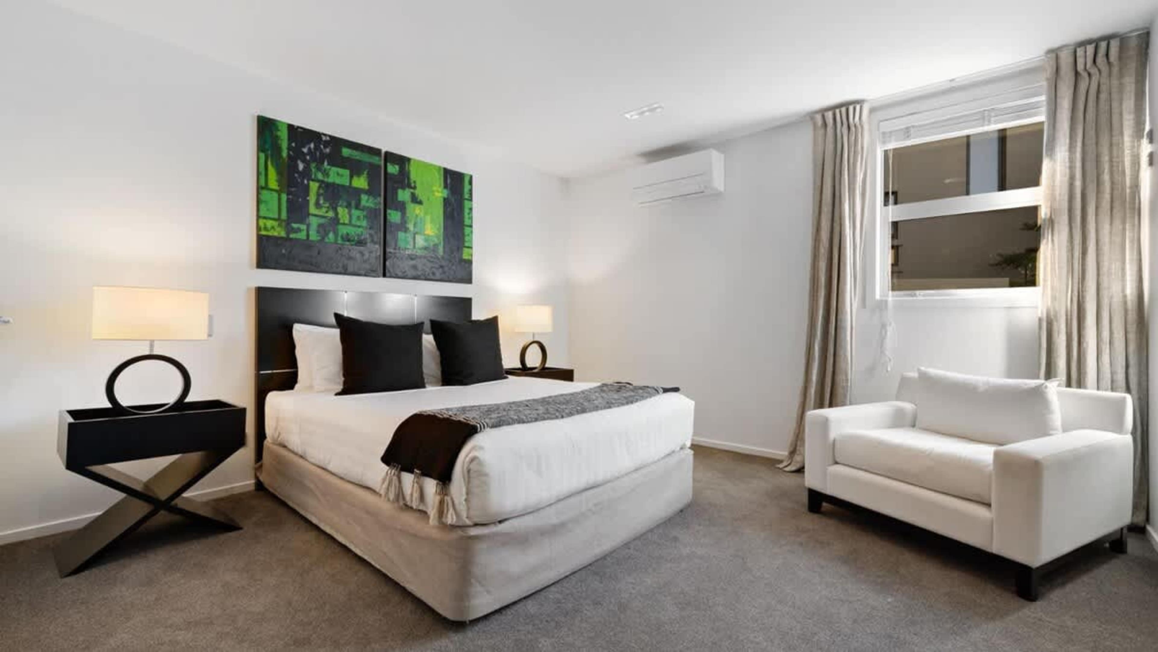 Inviting Third Bedroom with Ensuite
The third bedroom features a tranquil retreat with comfortable bedding, stylish decor, and its own private ensuite, ensuring ultimate comfort and privacy during your Queenstown stay.